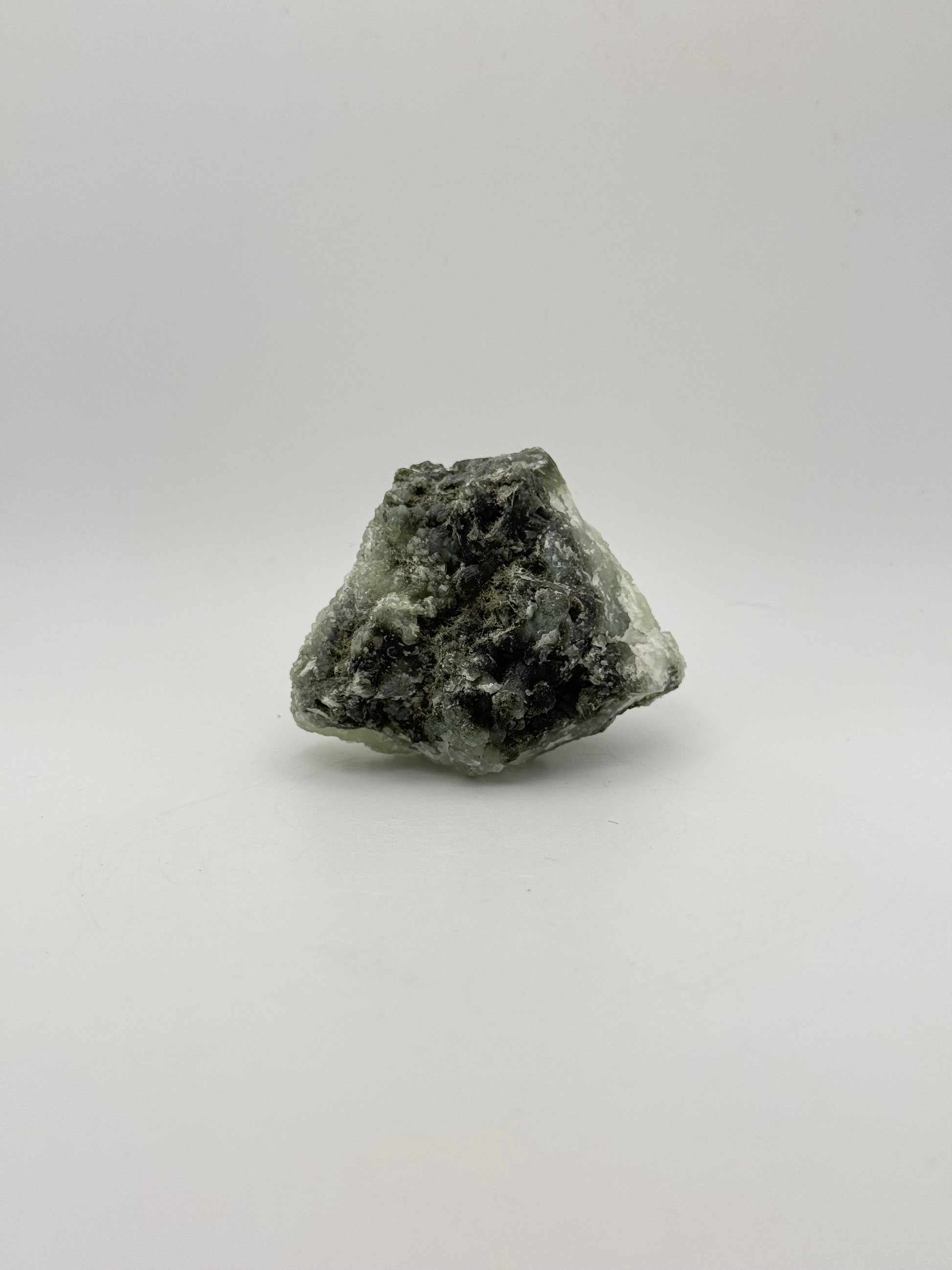 Raw Prehnite specimen with amazing green color.