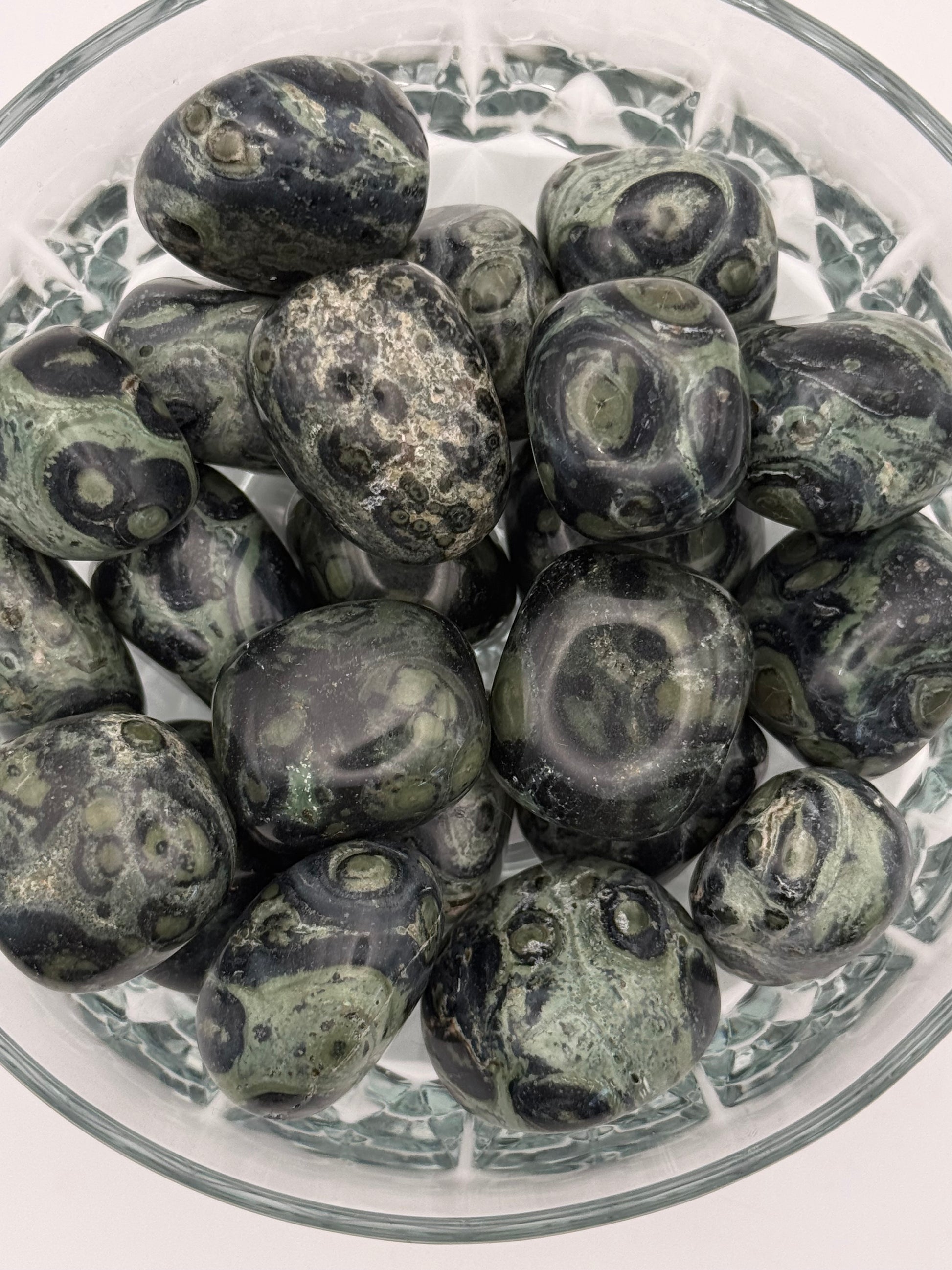 Close-up of polished kambaba jasper tumbles.