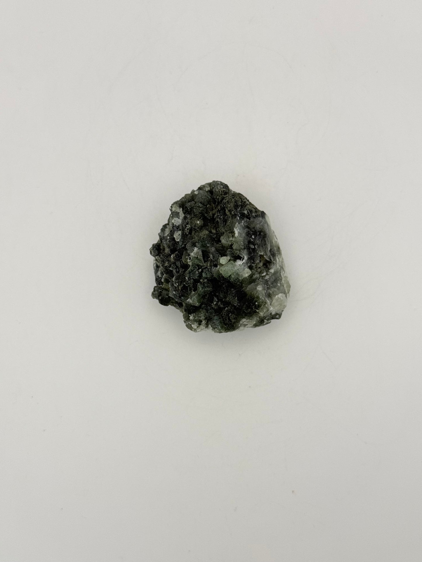 Raw Prehnite specimen with amazing green color.