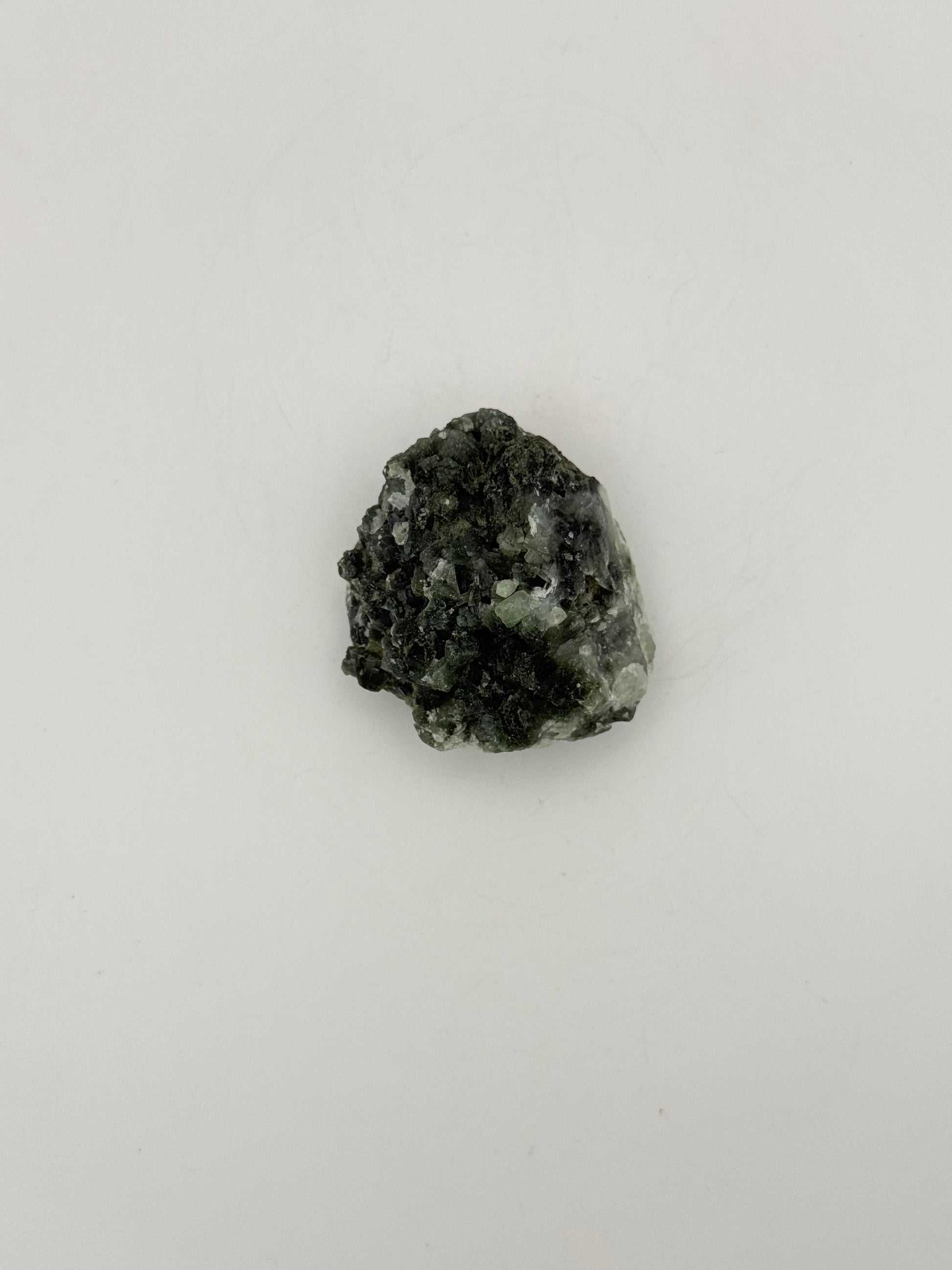 Raw Prehnite specimen with amazing green color.