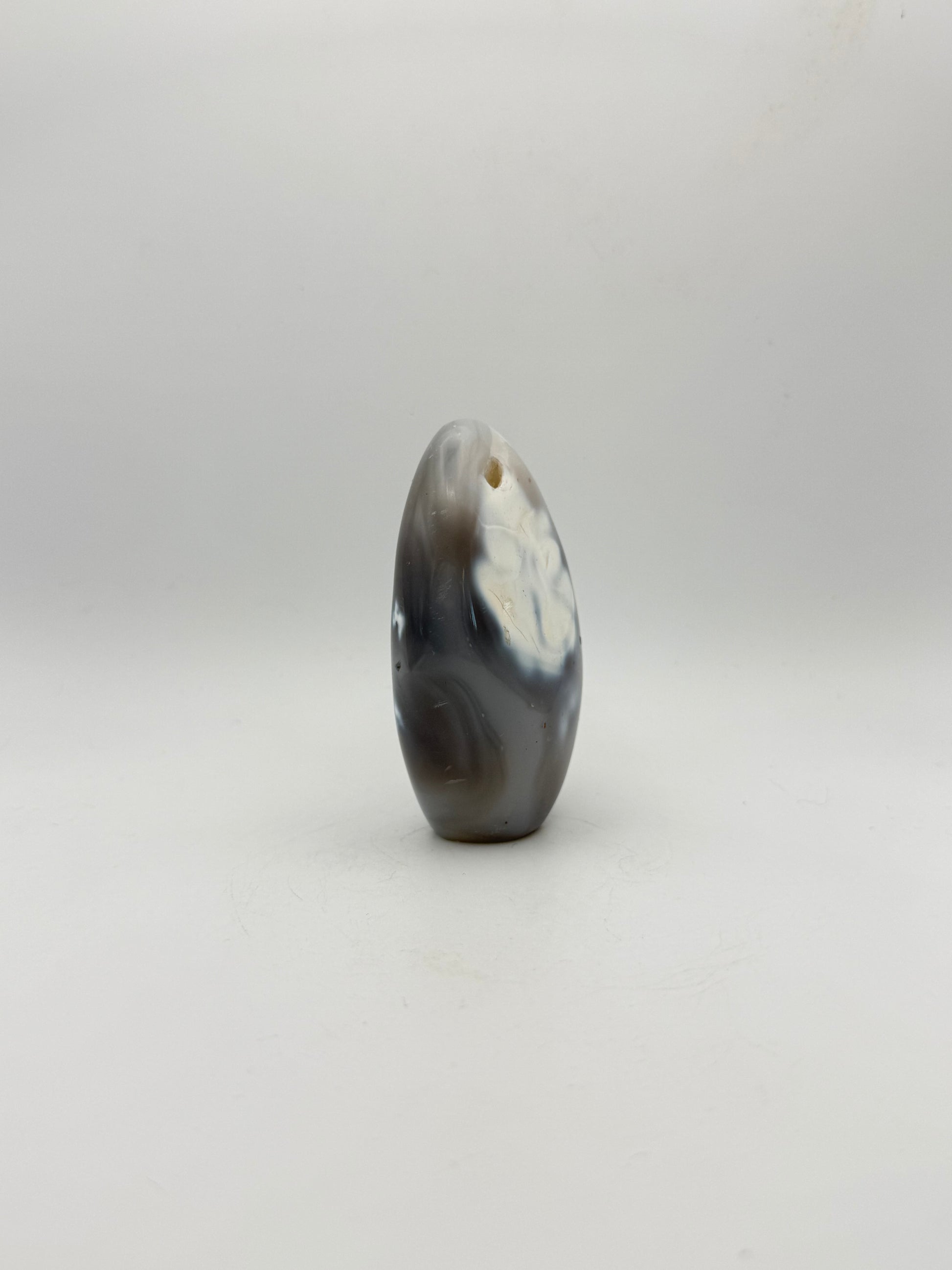 Polished orca agate free form.