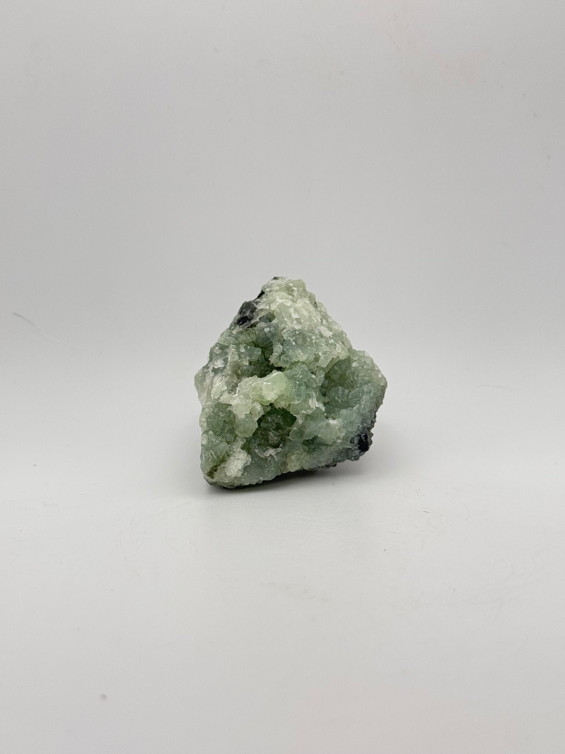 Raw Prehnite specimen with amazing green color.