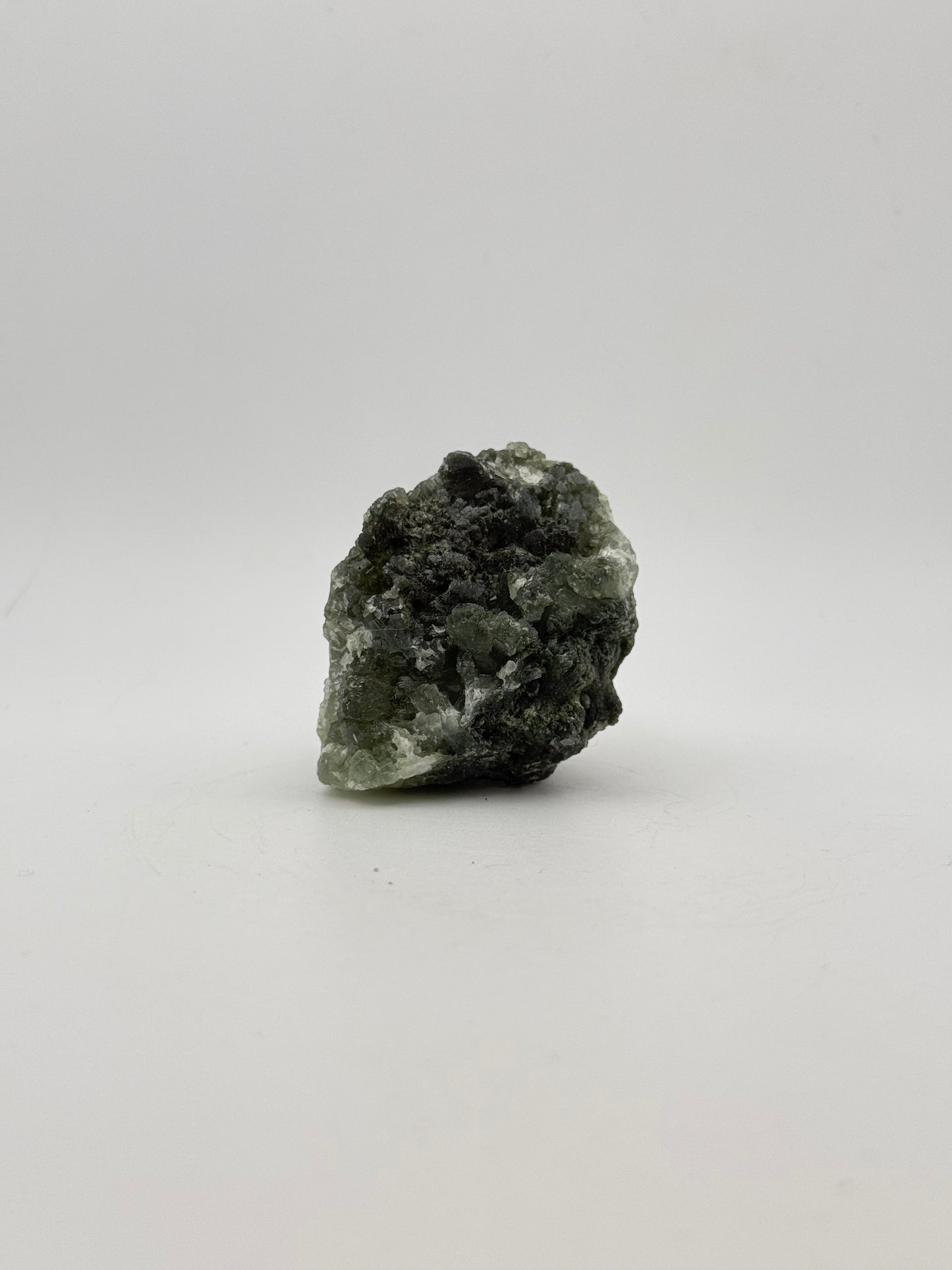 Raw Prehnite specimen with amazing green color.
