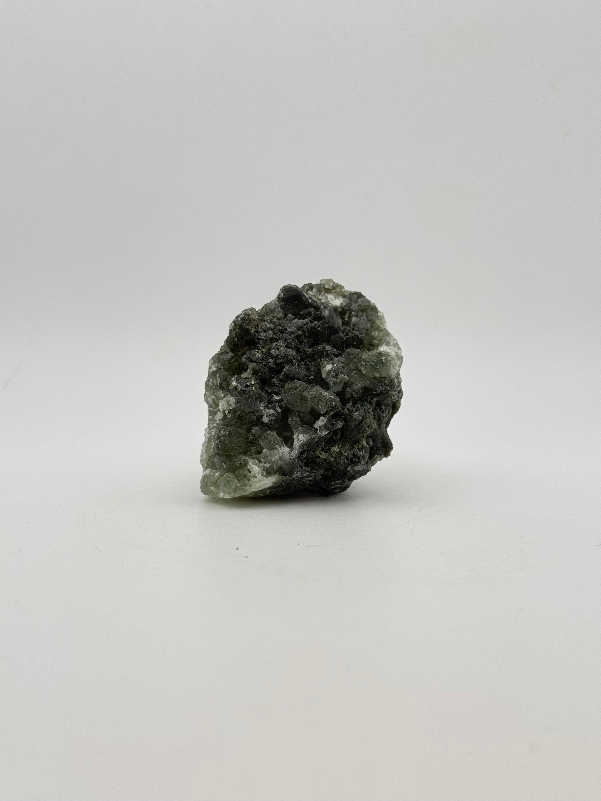 Raw Prehnite specimen with amazing green color.