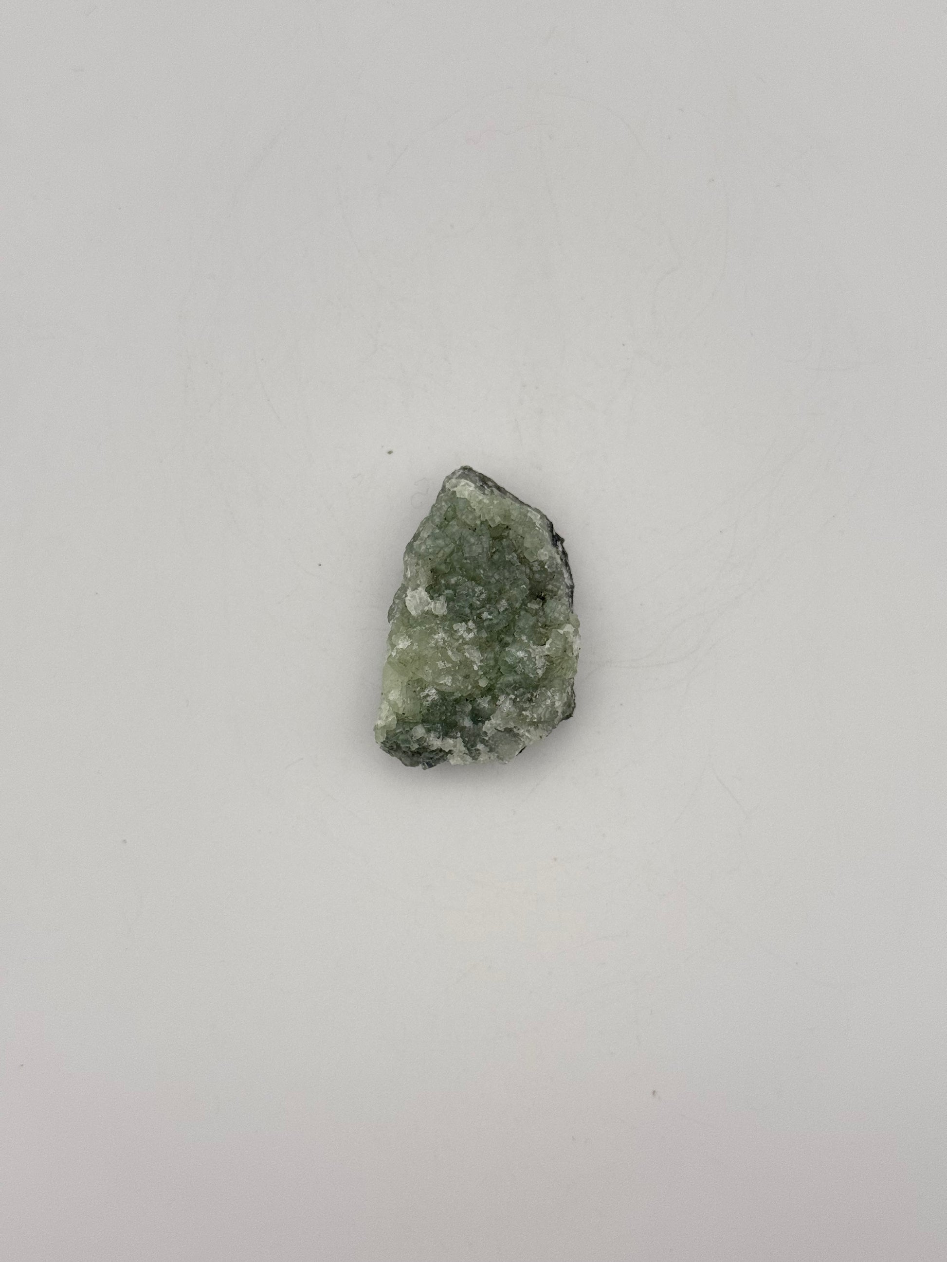 Raw Prehnite specimen with amazing green color.