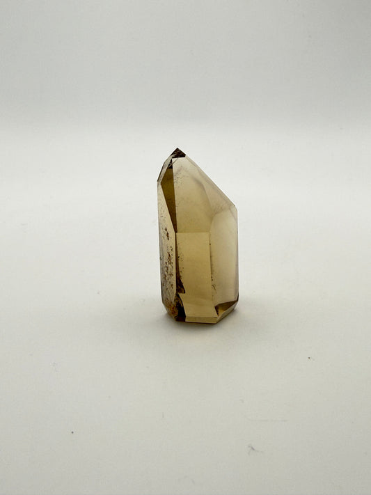 Polished natural citrine point.