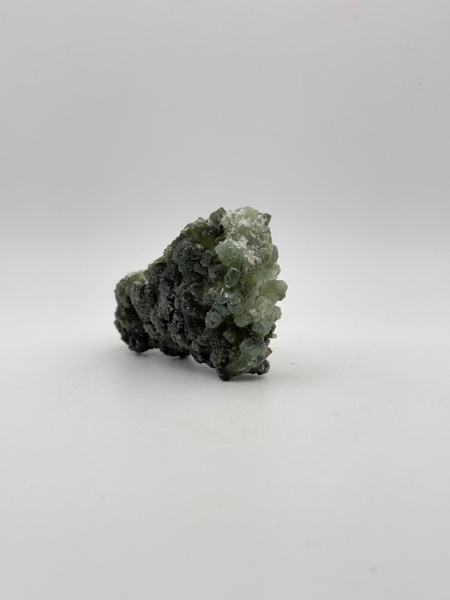 Raw Prehnite specimen with amazing green color.