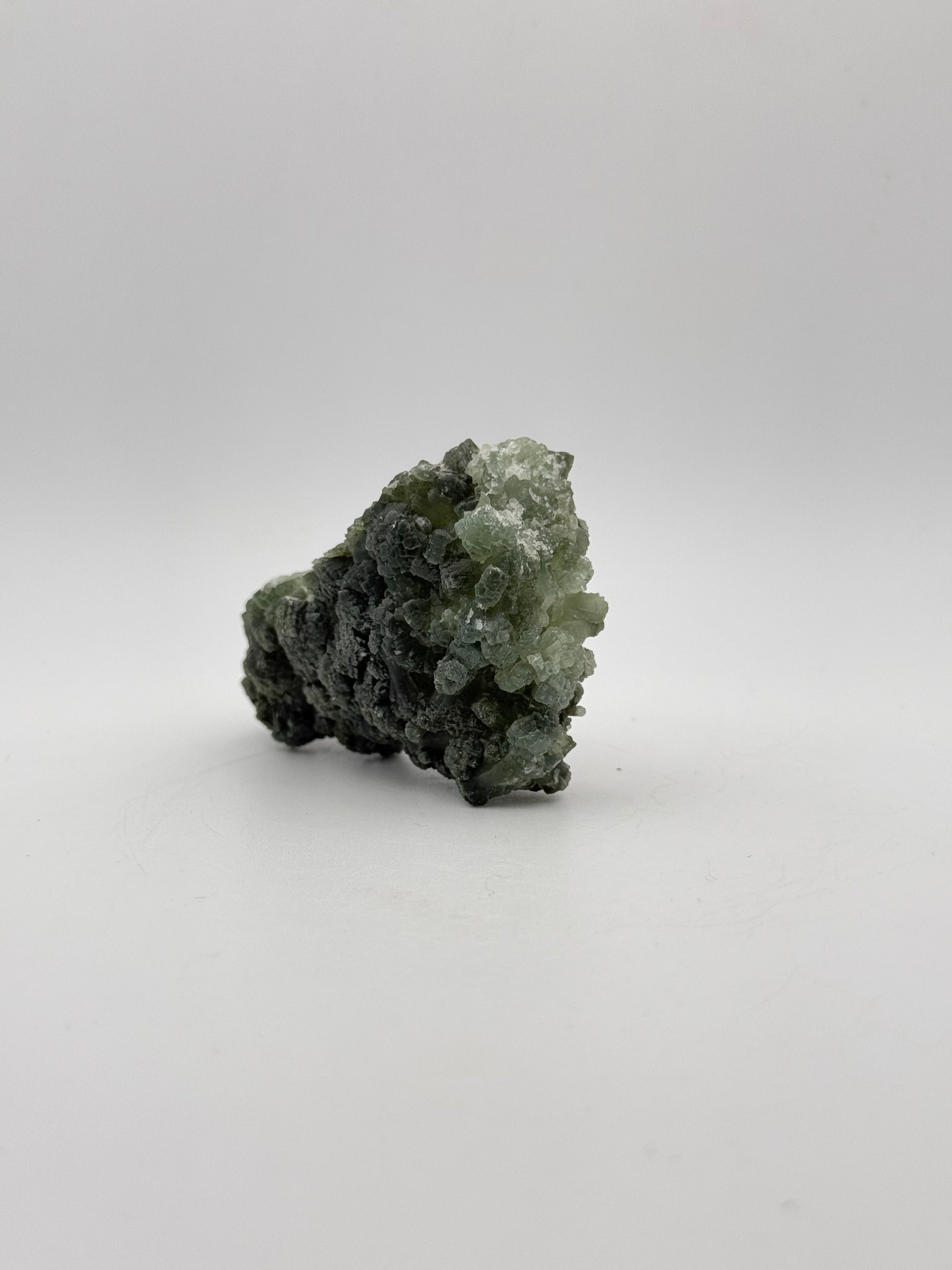 Raw Prehnite specimen with amazing green color.