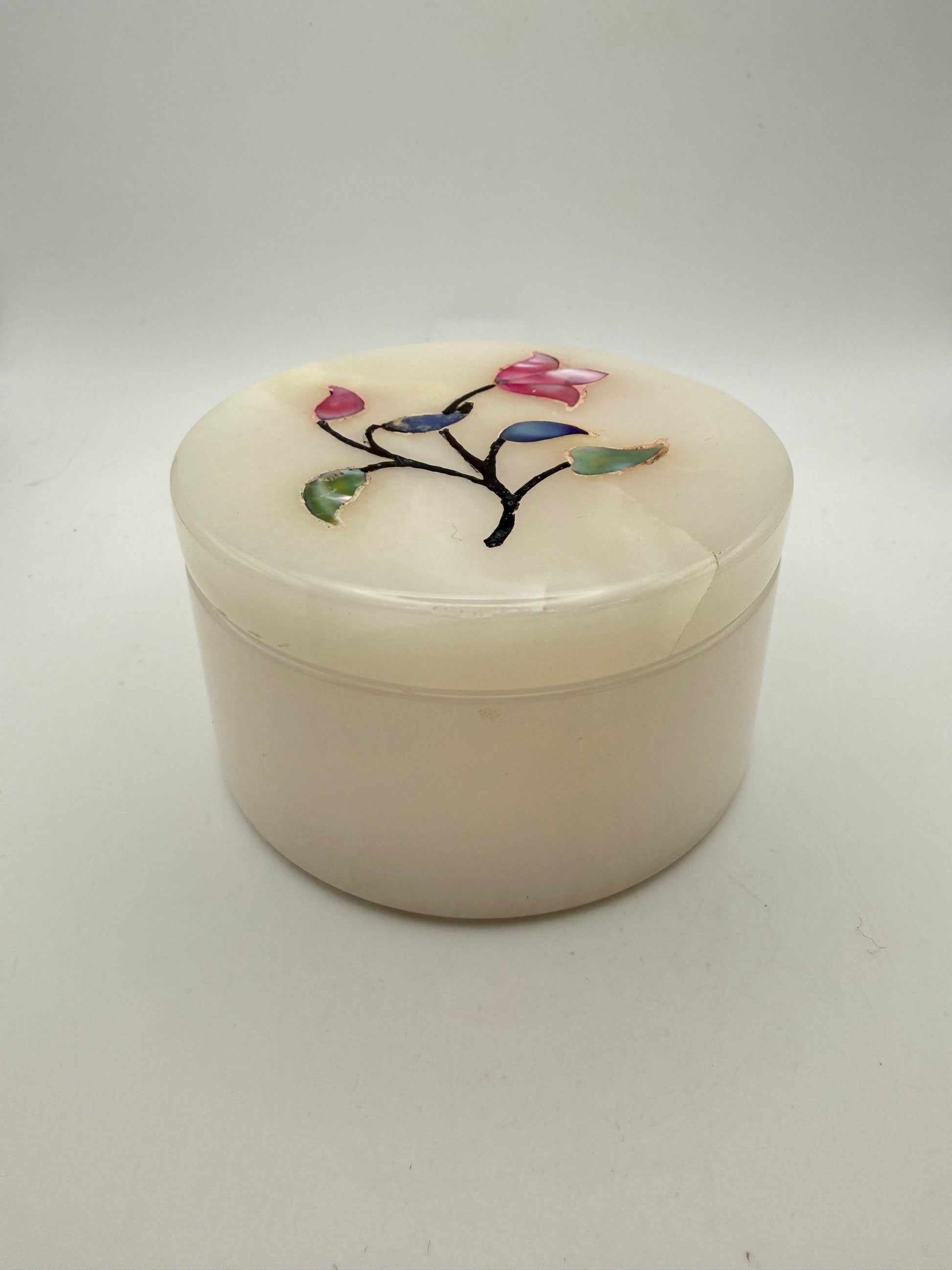 Onyx jewelry box with flowers on the lid.