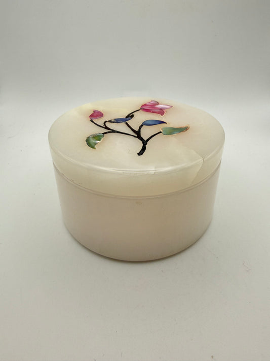 Onyx jewelry box with flowers on the lid.