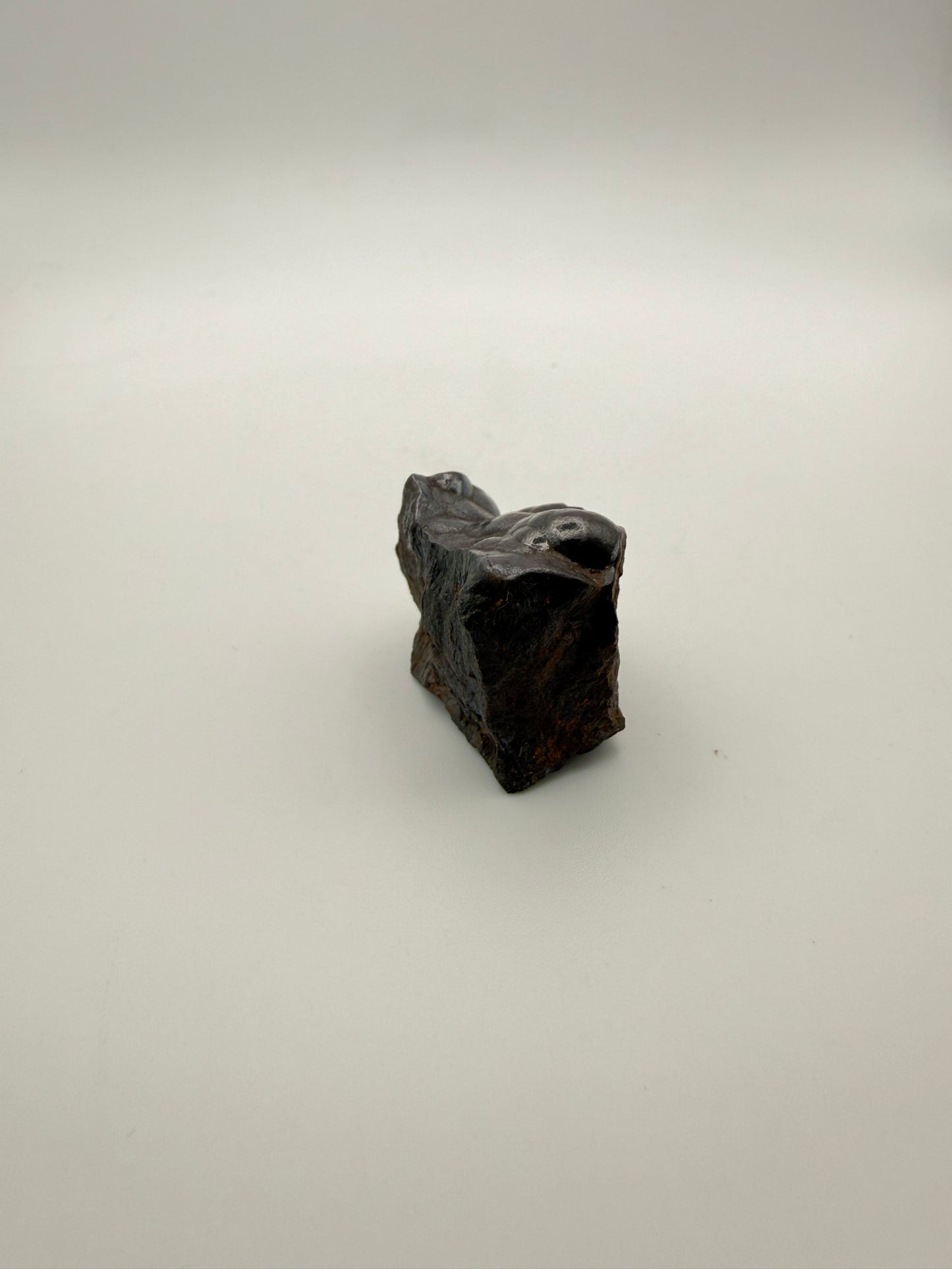 Small raw hematite specimen.