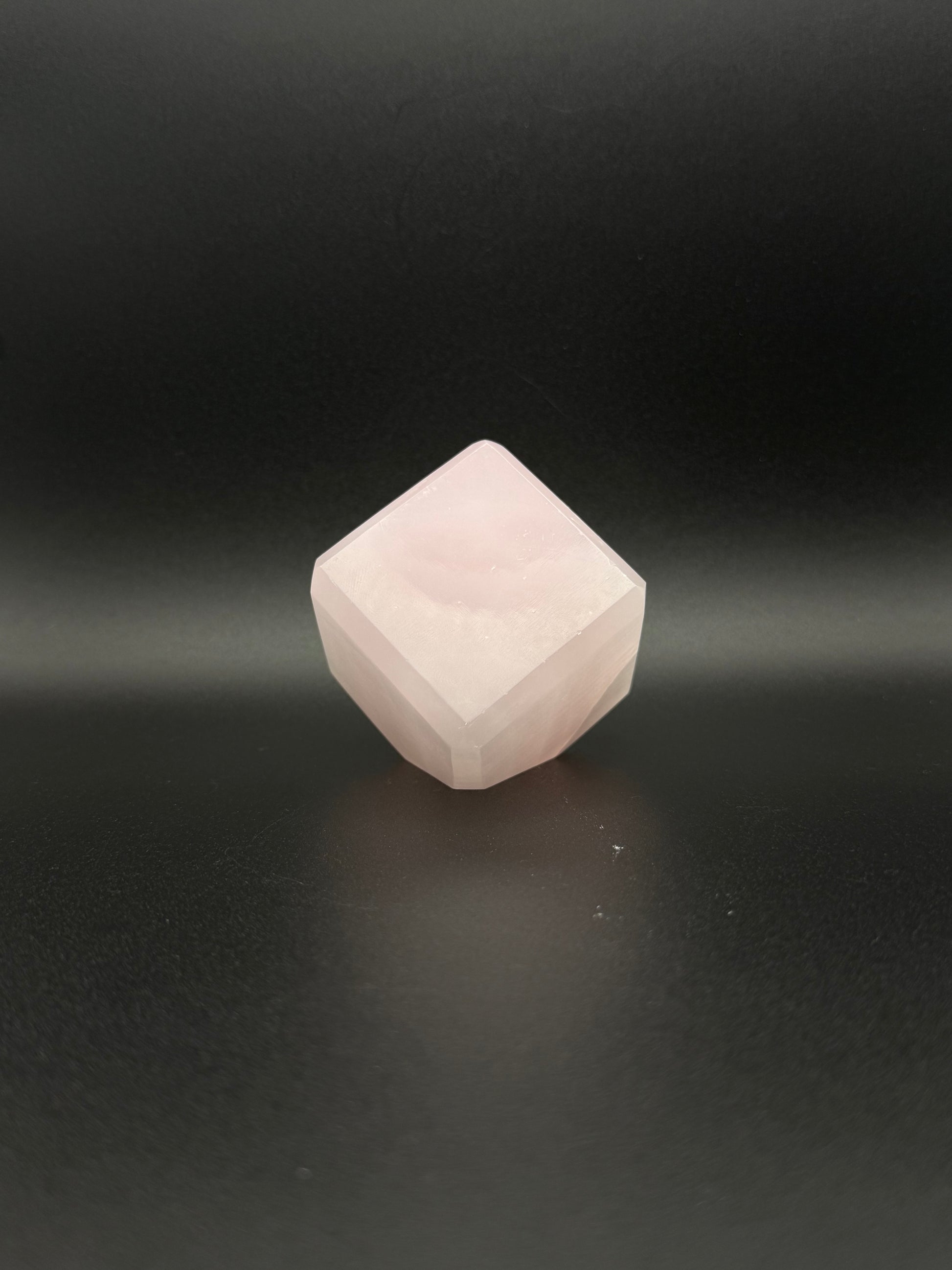 Polished Pink Calcite cut cube. Pink calcite is uv reactive.