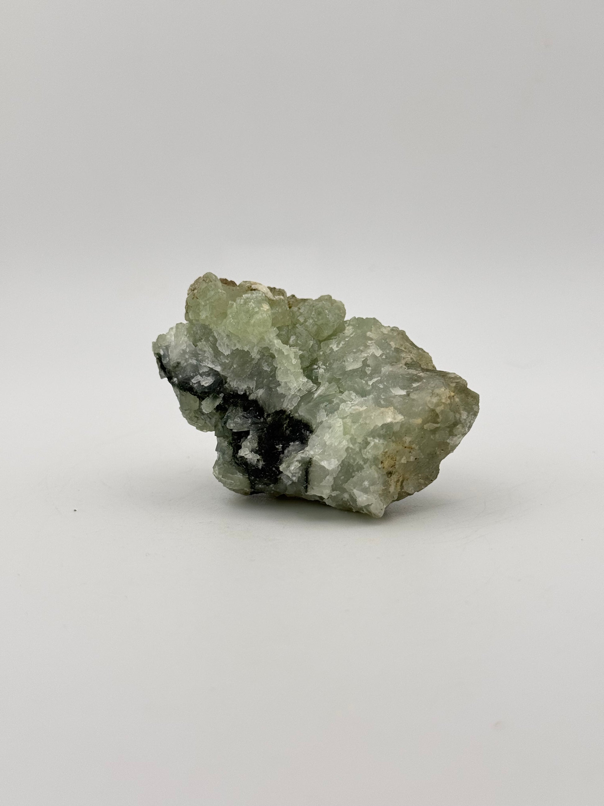 Raw Prehnite specimen with amazing green color.