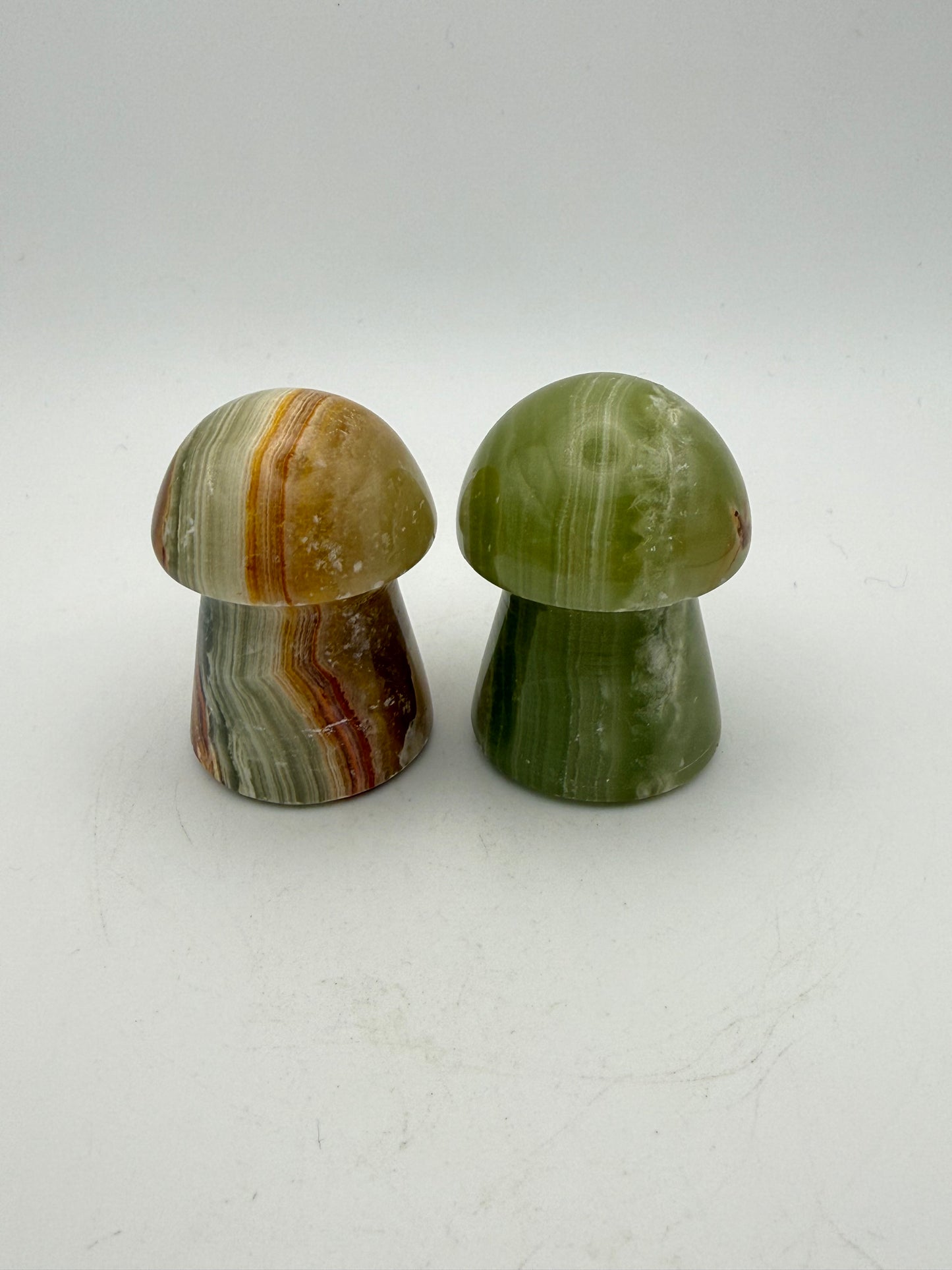 Two onyx mushroom-shaped stones.