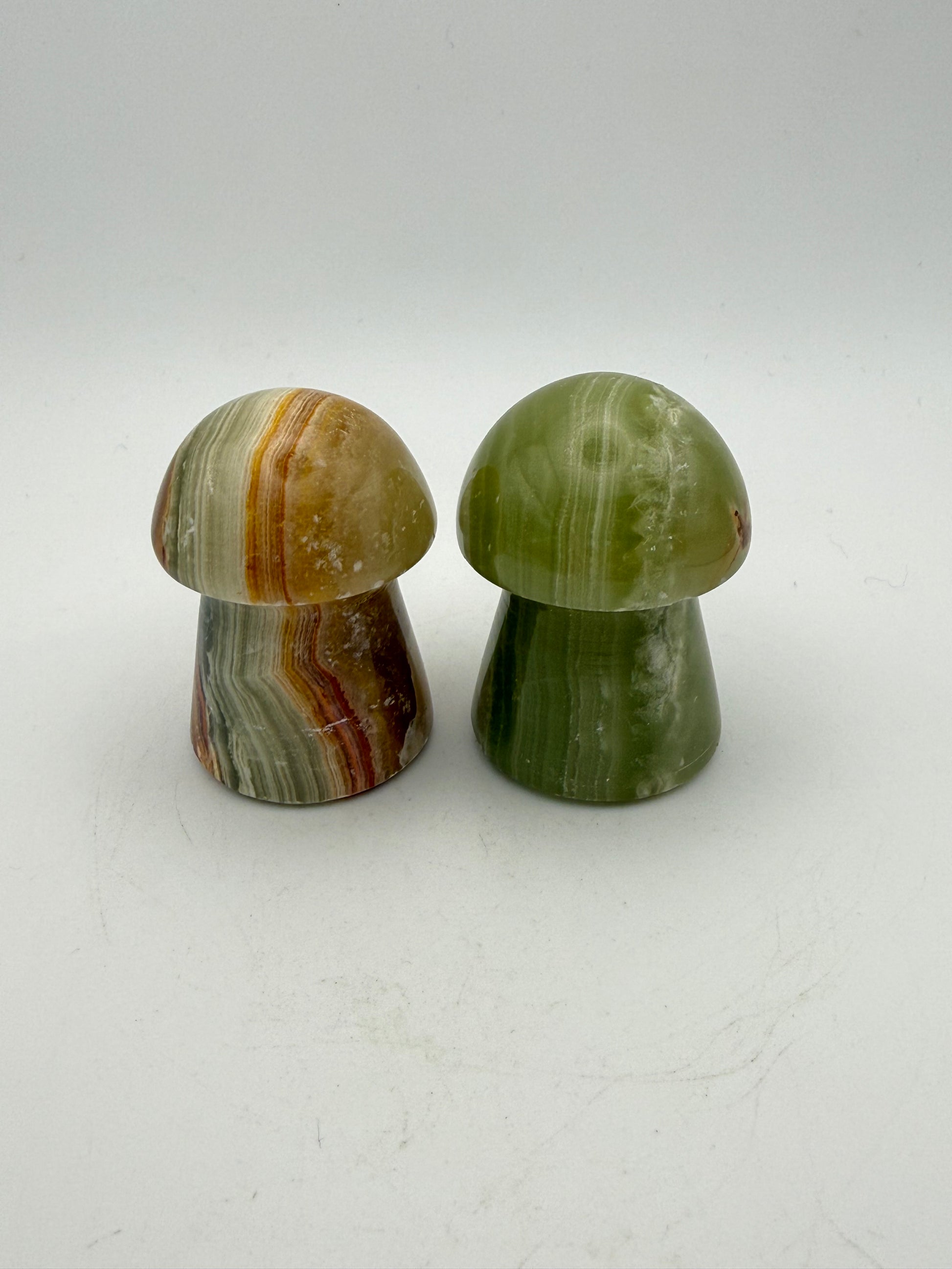Two onyx mushroom-shaped stones.