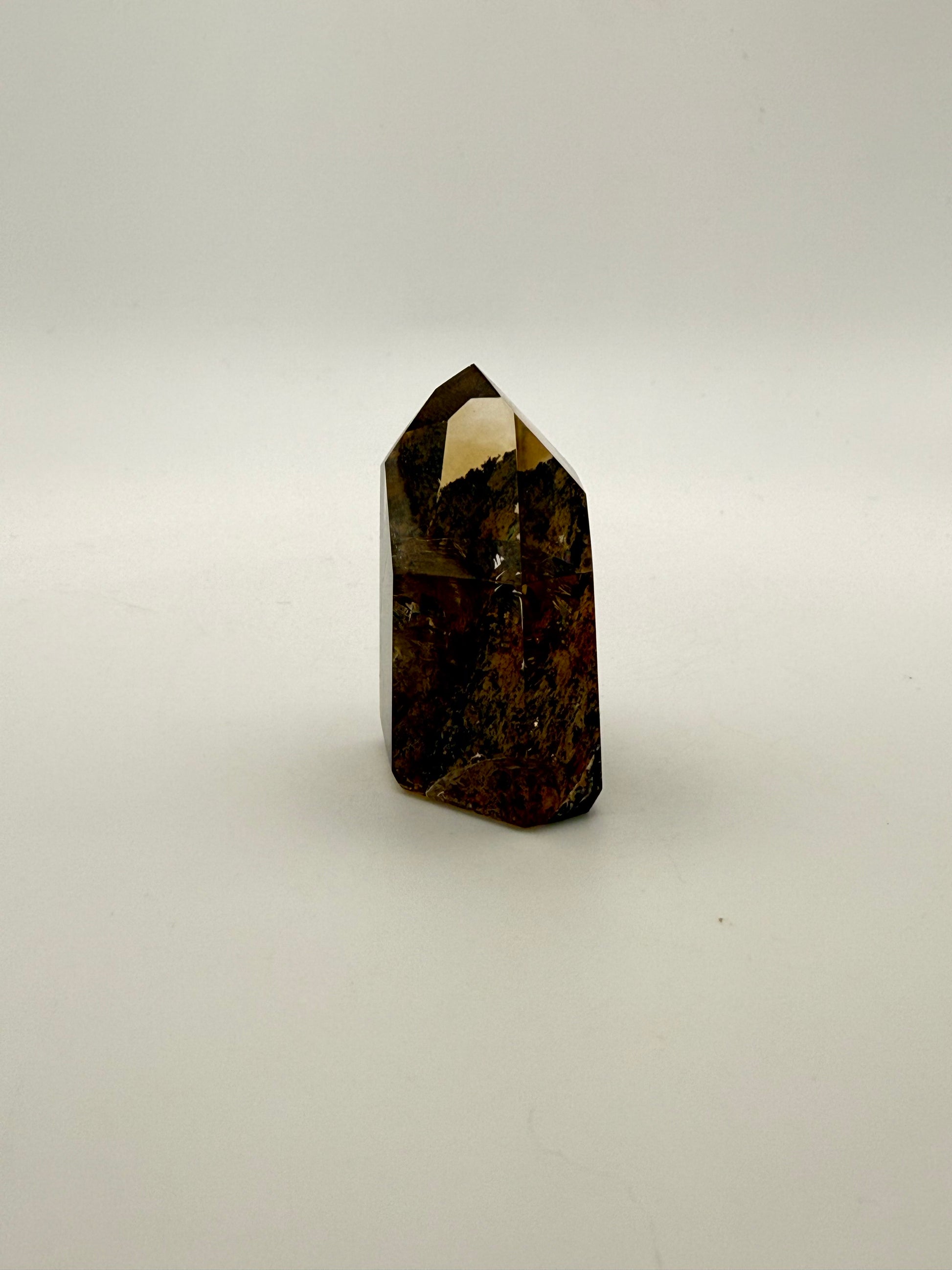 Polished natural citrine point.