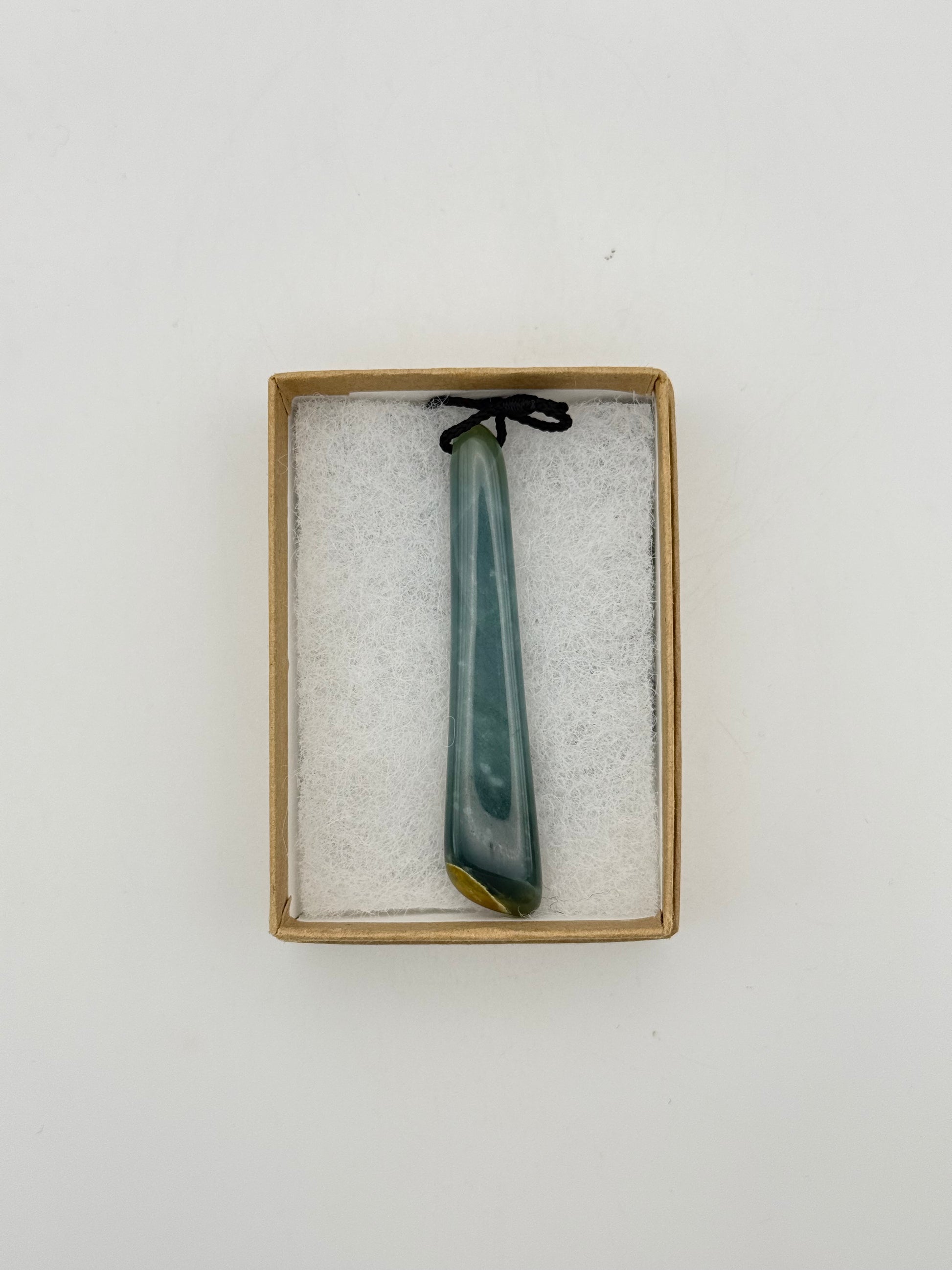 Green Jade pendant with string necklace.
