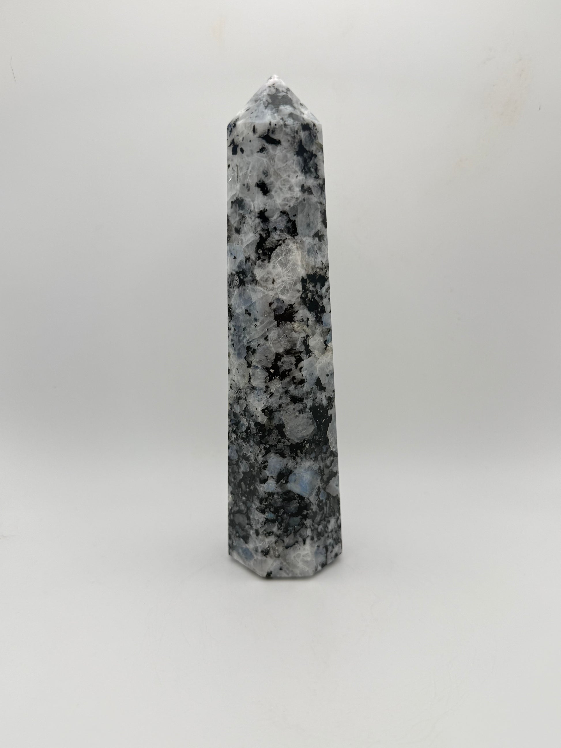 Rainbow moonstone polished tower with nice flashes of blue.