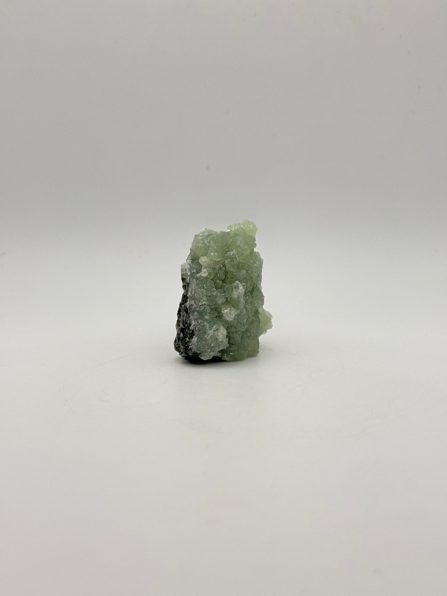 Raw Prehnite specimen with amazing green color.