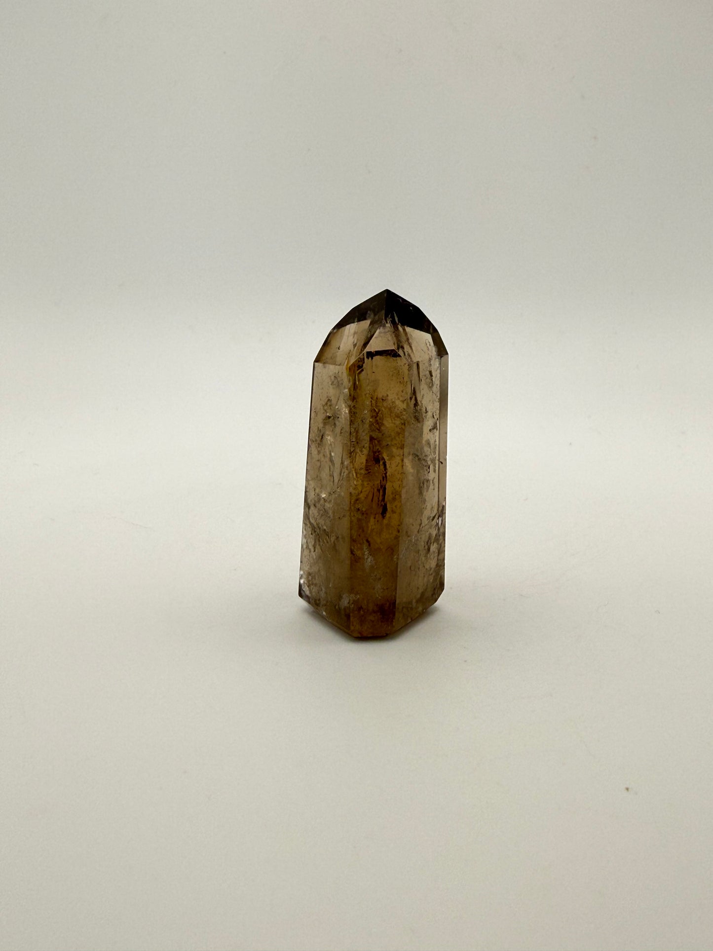 Polished natural citrine point.