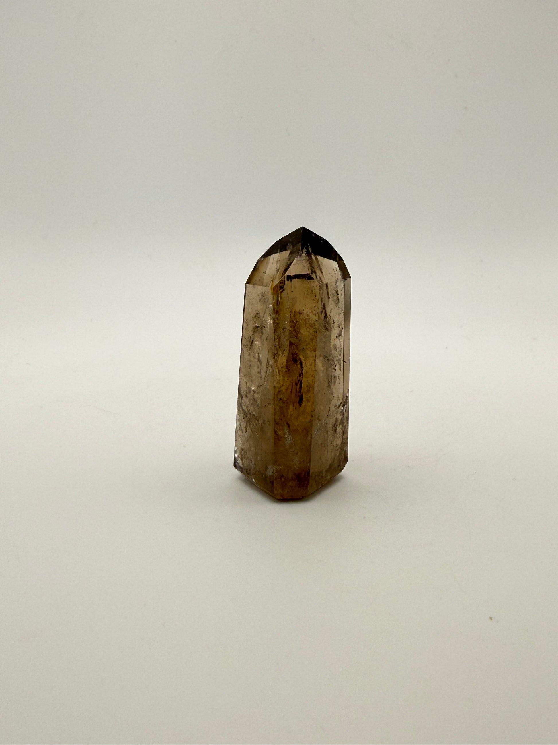 Polished natural citrine point.