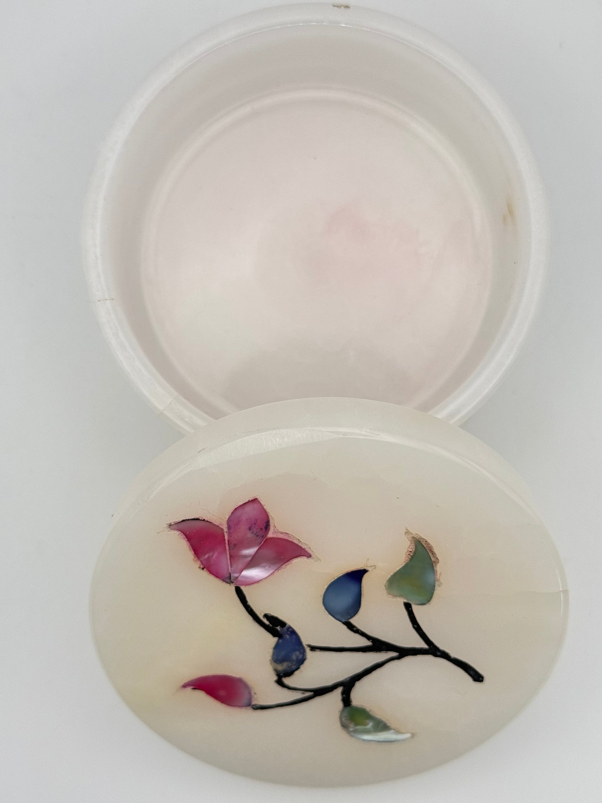 Onyx jewelry box with flowers on the lid.
