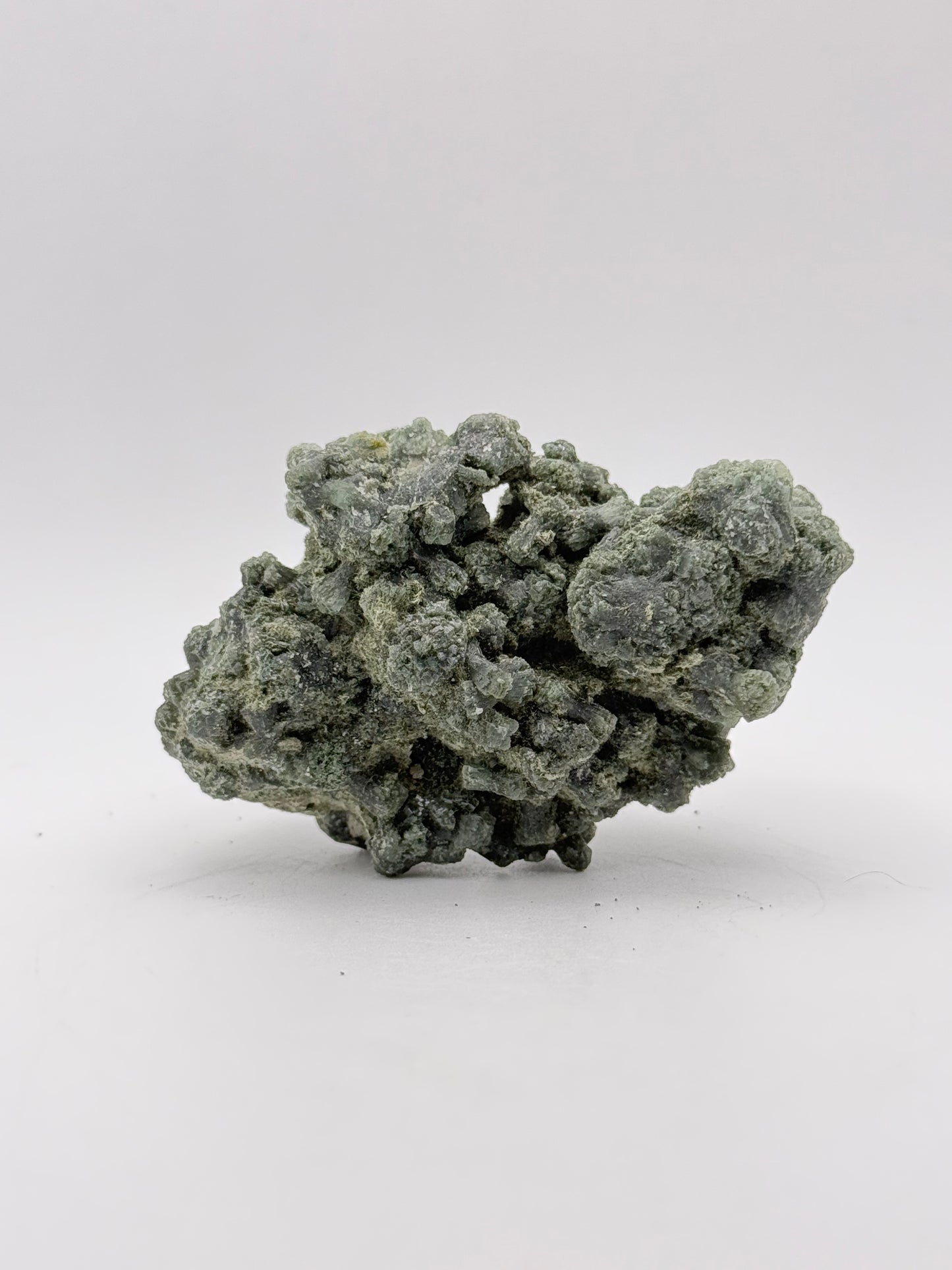 Raw prehnite specimen with amazing green color.