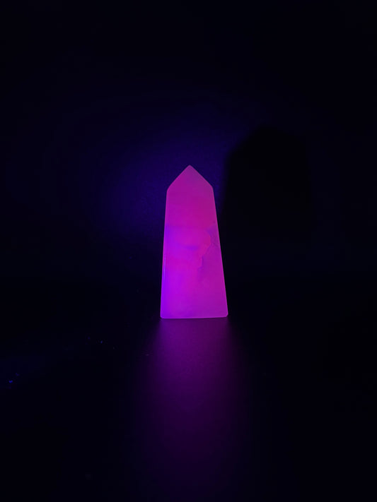 Polished pink calcite tower. Pink calcite glows under uv light.