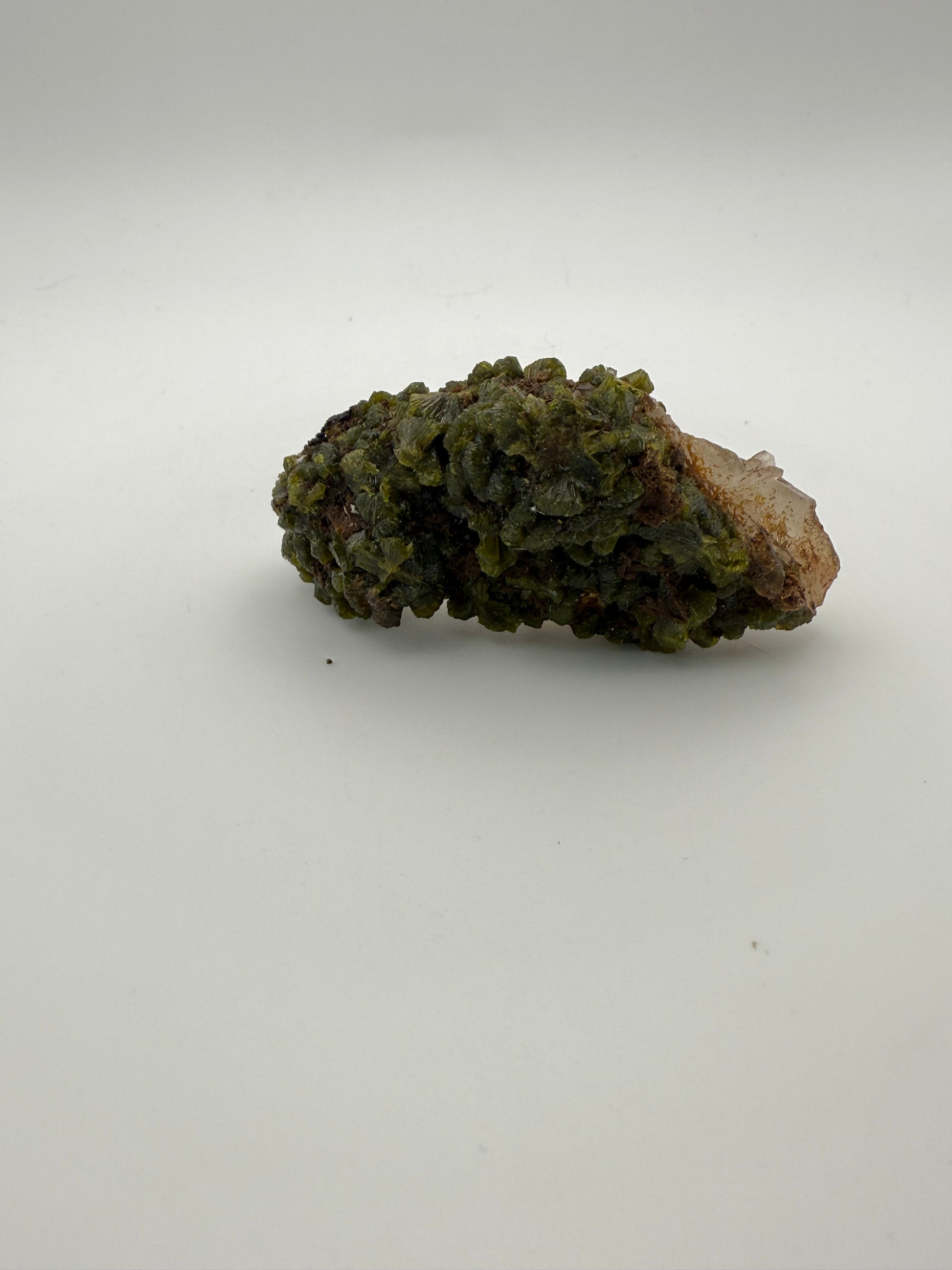 Epidote crystal cluster with good green color.