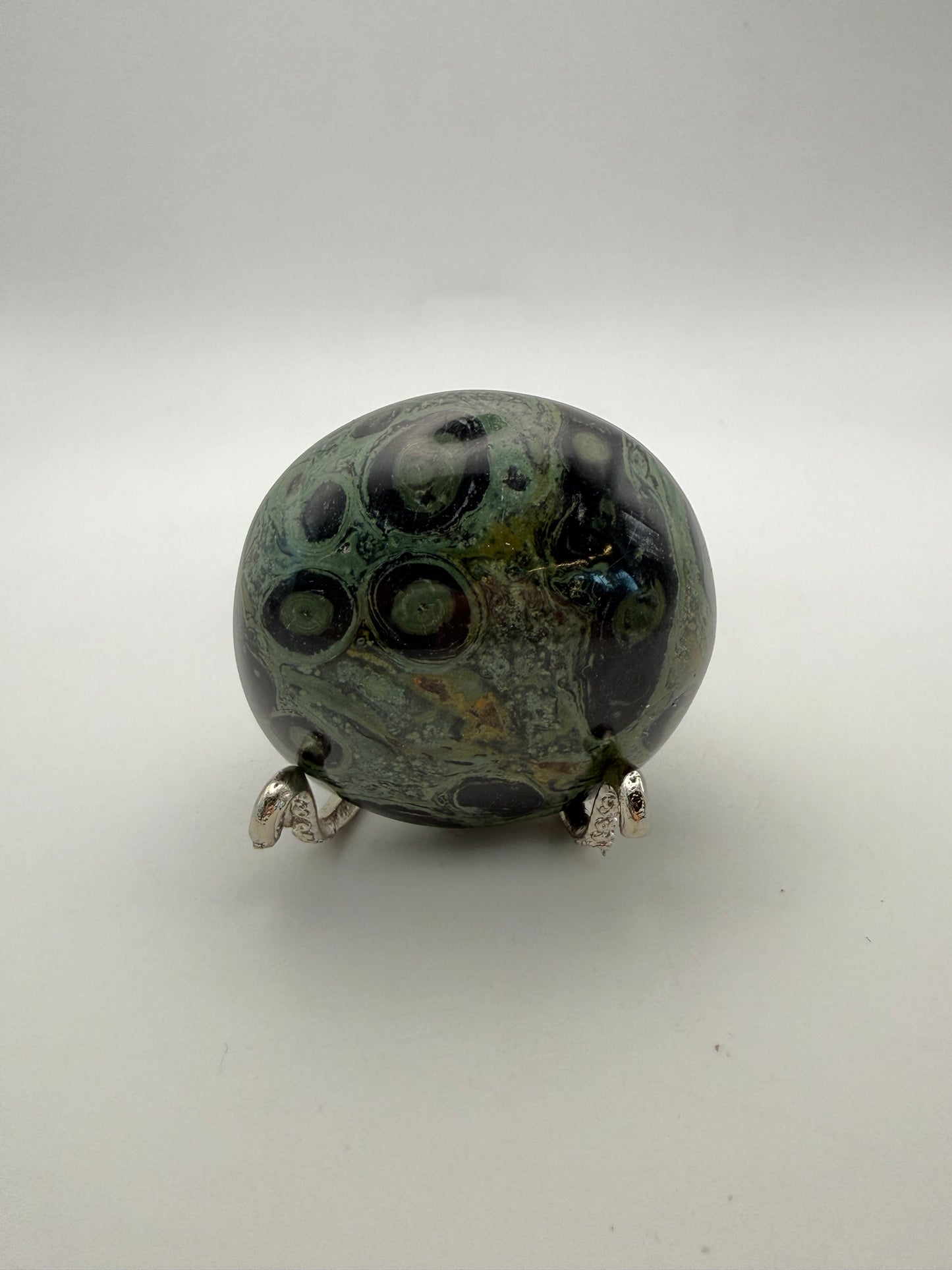 Polished kambaba jasper palm stone.