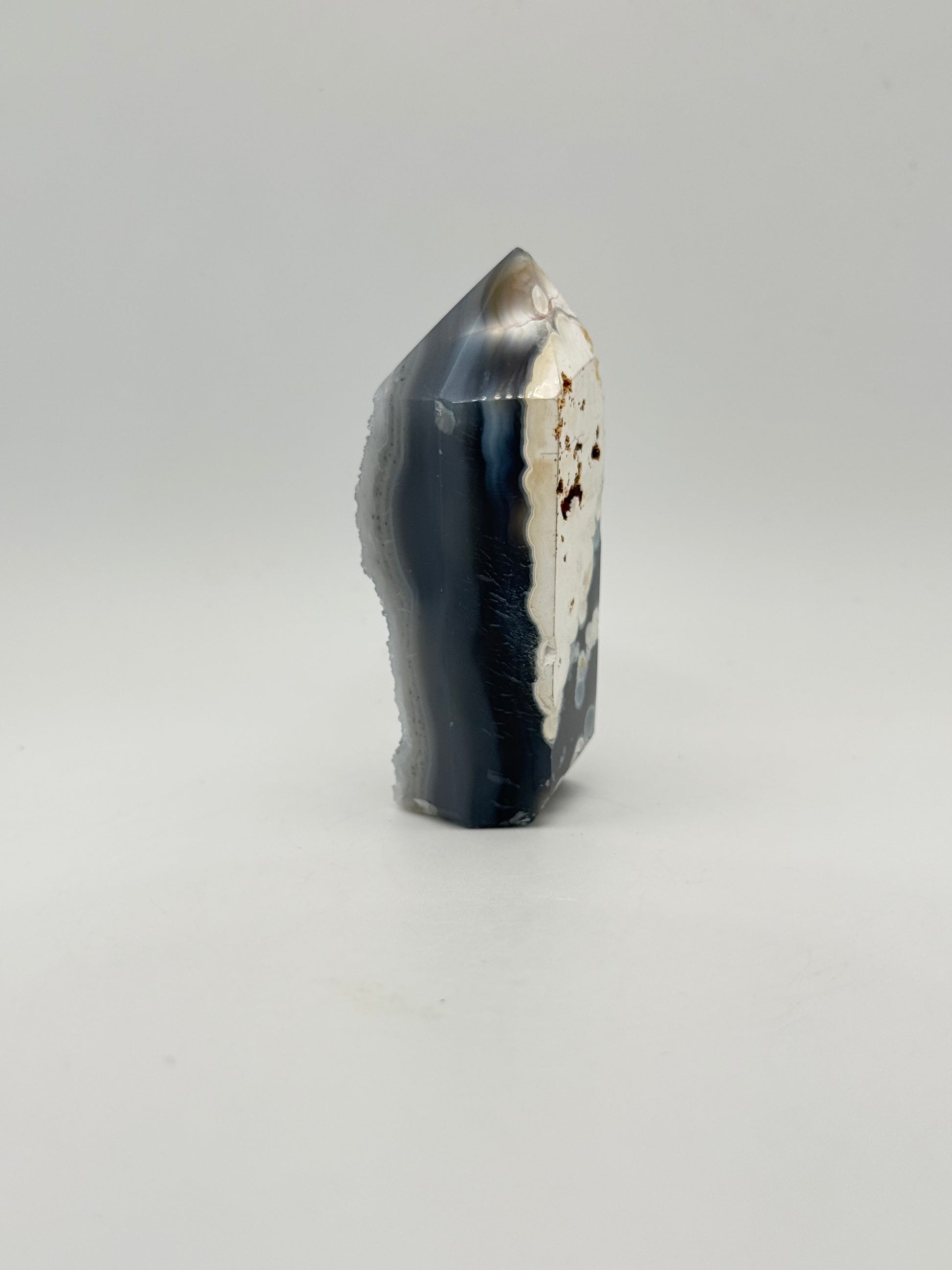 Polished druzy agate tower. About 3  inches tall.