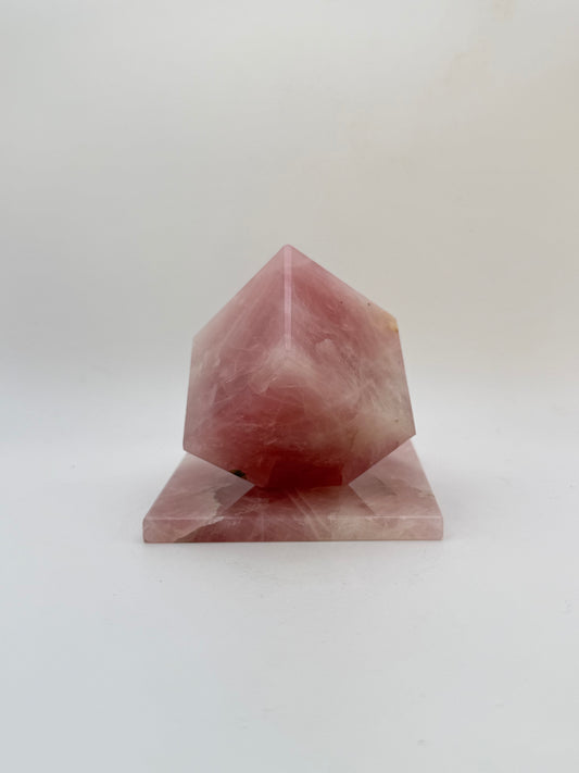 Polished rose quartz cut cube.