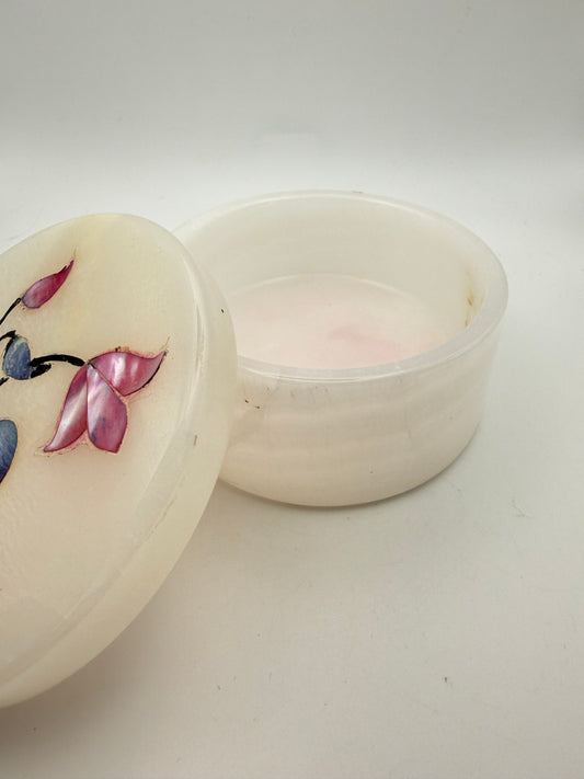 Onyx jewelry box with flowers on the lid.