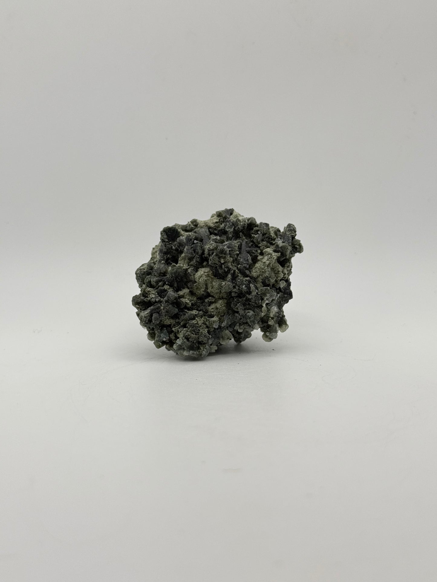 Raw prehnite specimen with amazing green color.