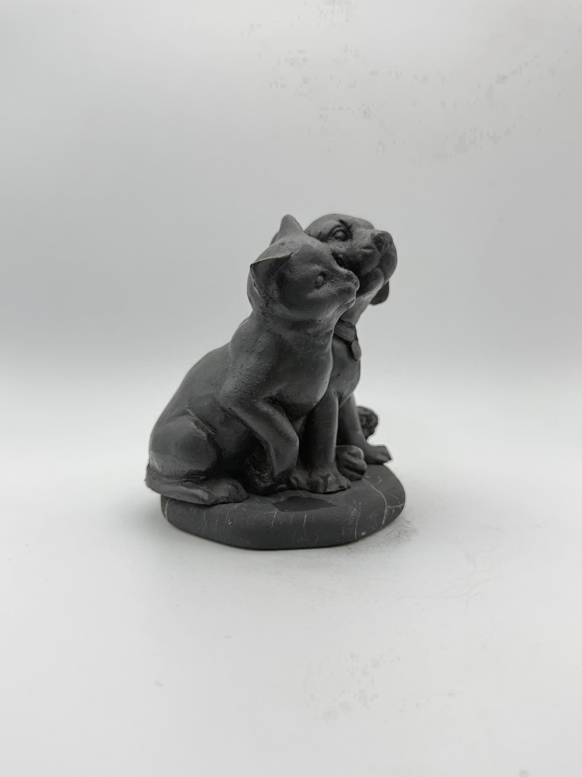 Shungite carving of a cat and dog.