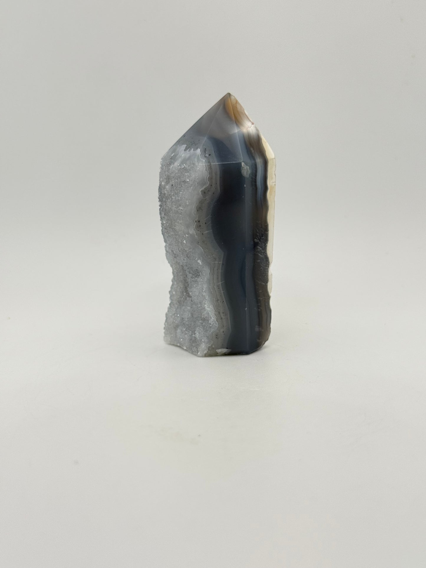 Polished druzy agate tower. About 3  inches tall.