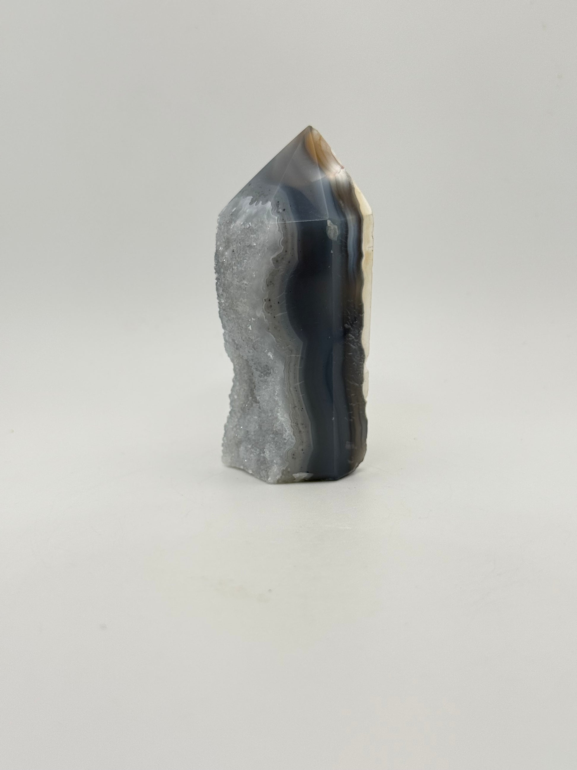 Polished druzy agate tower. About 3  inches tall.