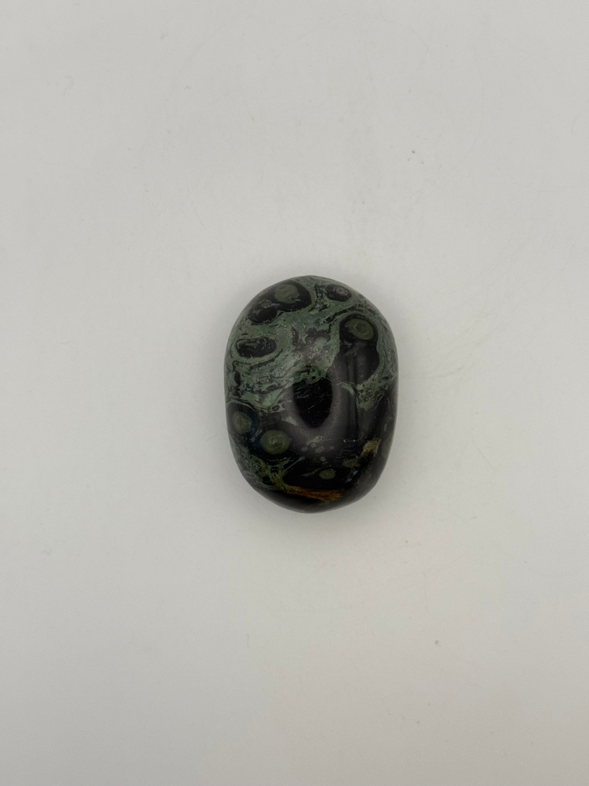 Polished kambaba jasper palm stone.