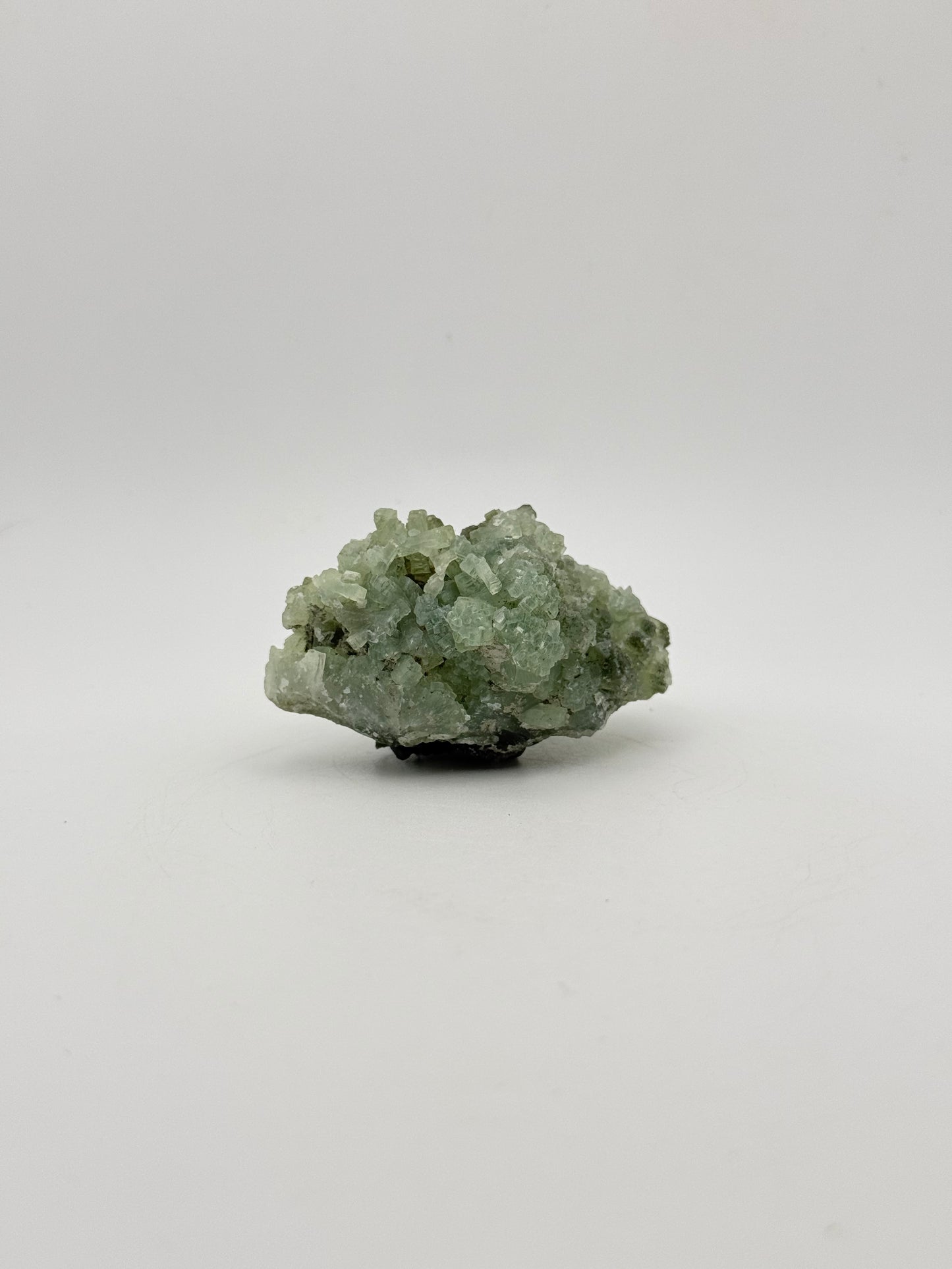 Raw Prehnite specimen with amazing green color.