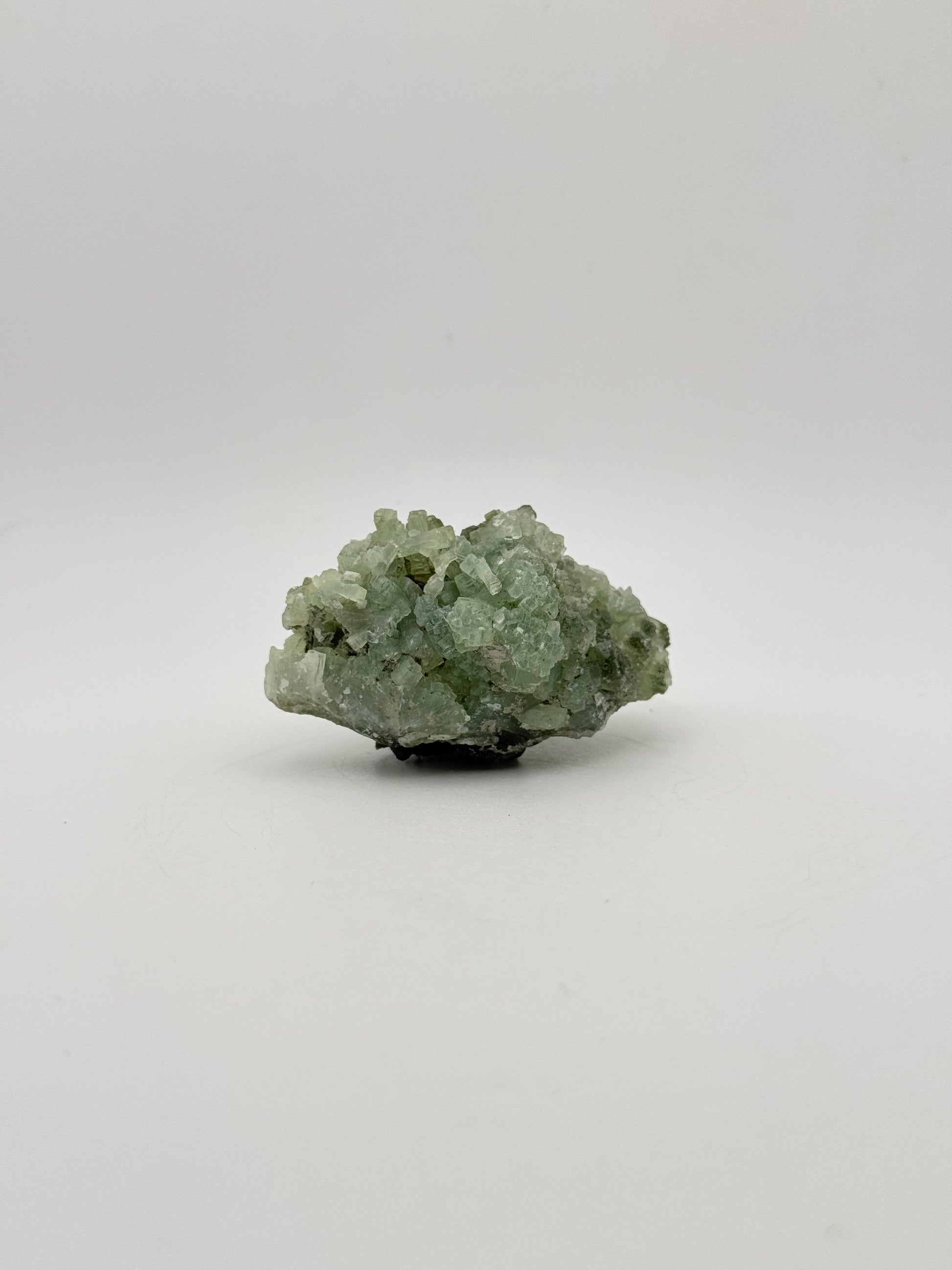 Raw Prehnite specimen with amazing green color.