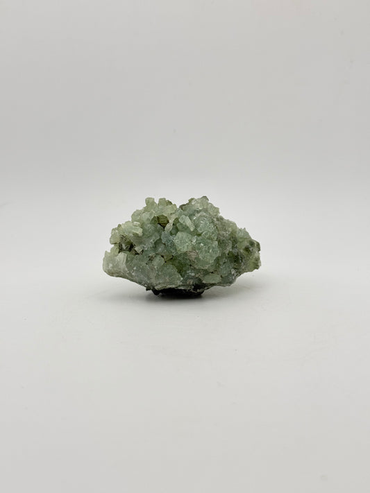 Raw Prehnite specimen with amazing green color.