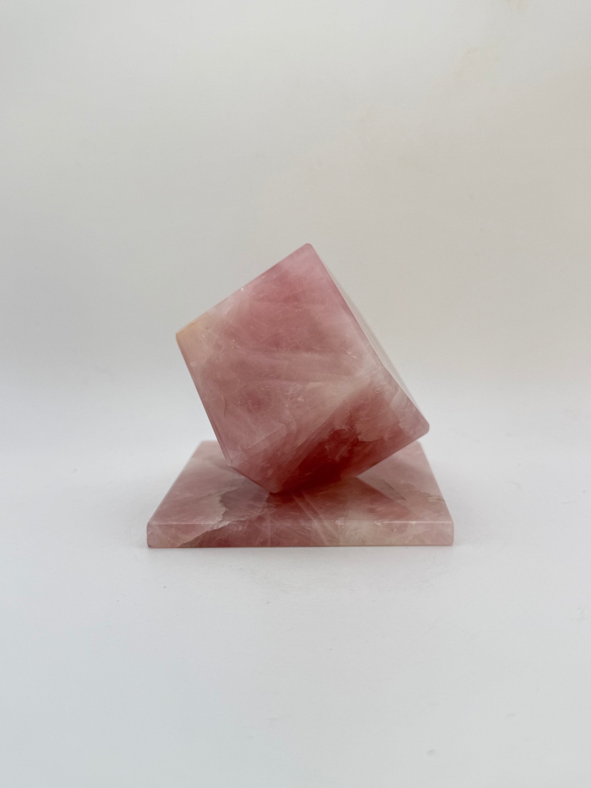 Polished rose quartz cut cube.