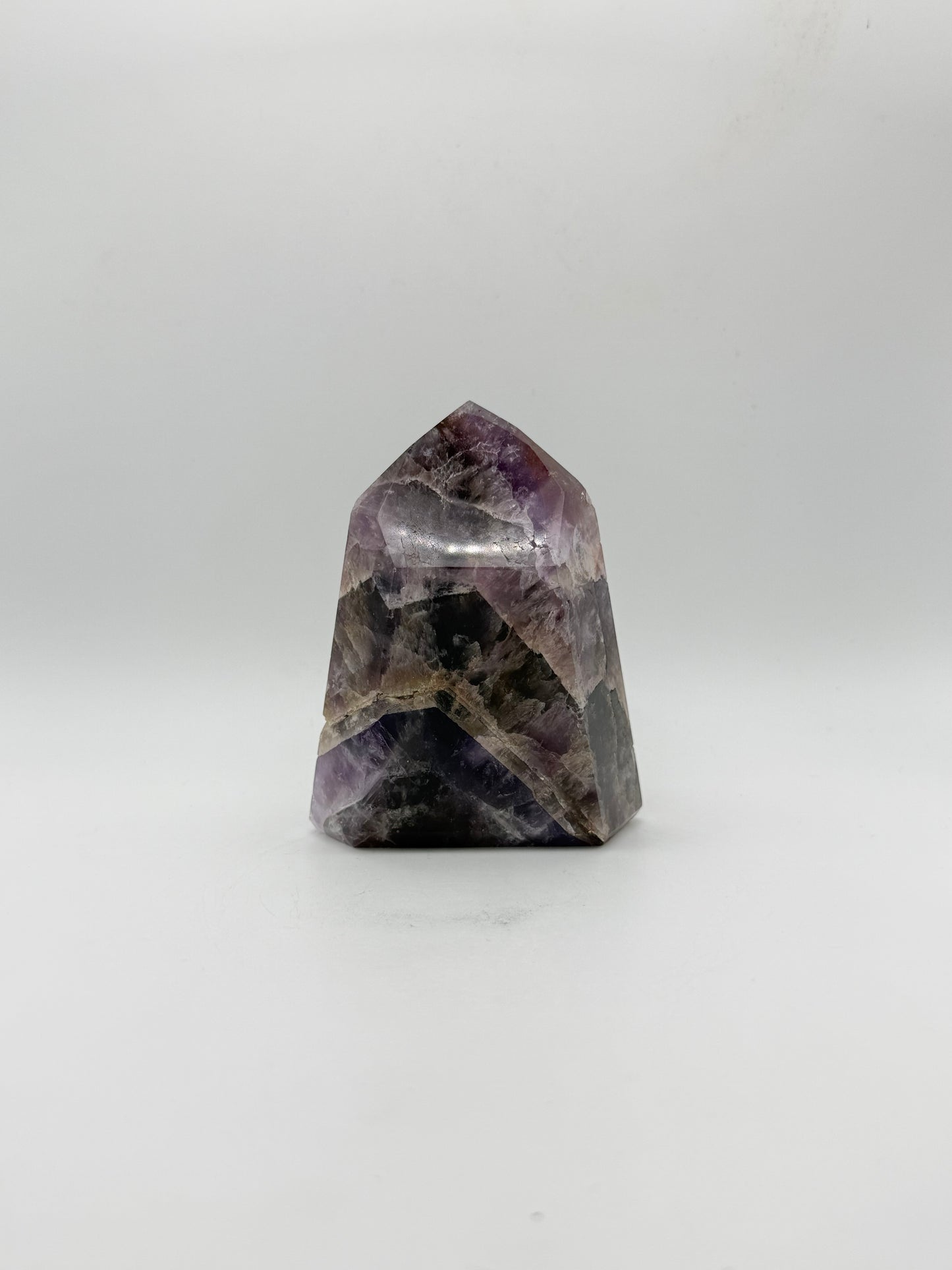 Polished super 7 in the shape of a tower.