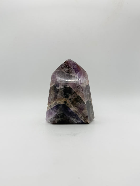 Polished super 7 in the shape of a tower.