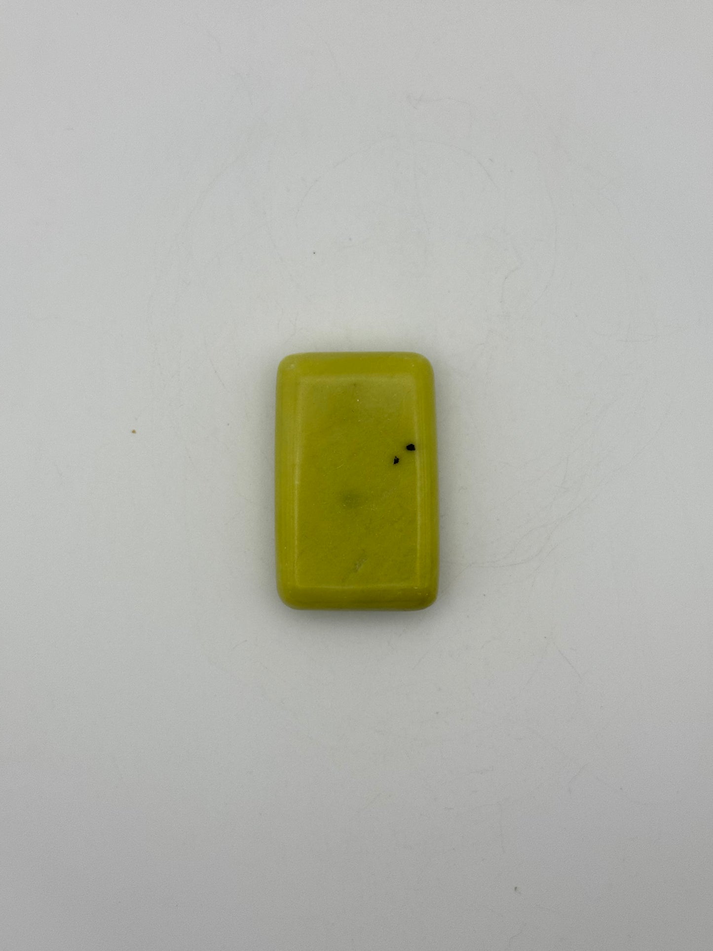Polished healerite in the shape of a rectangular soap.