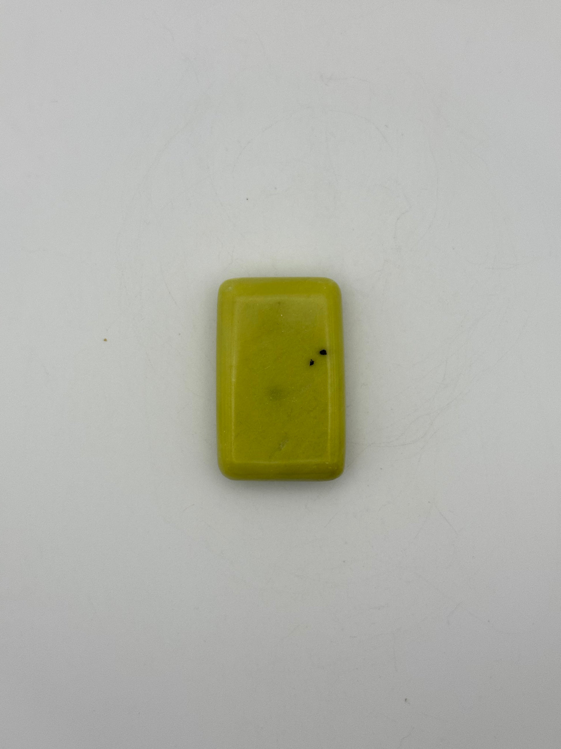 Polished healerite in the shape of a rectangular soap.
