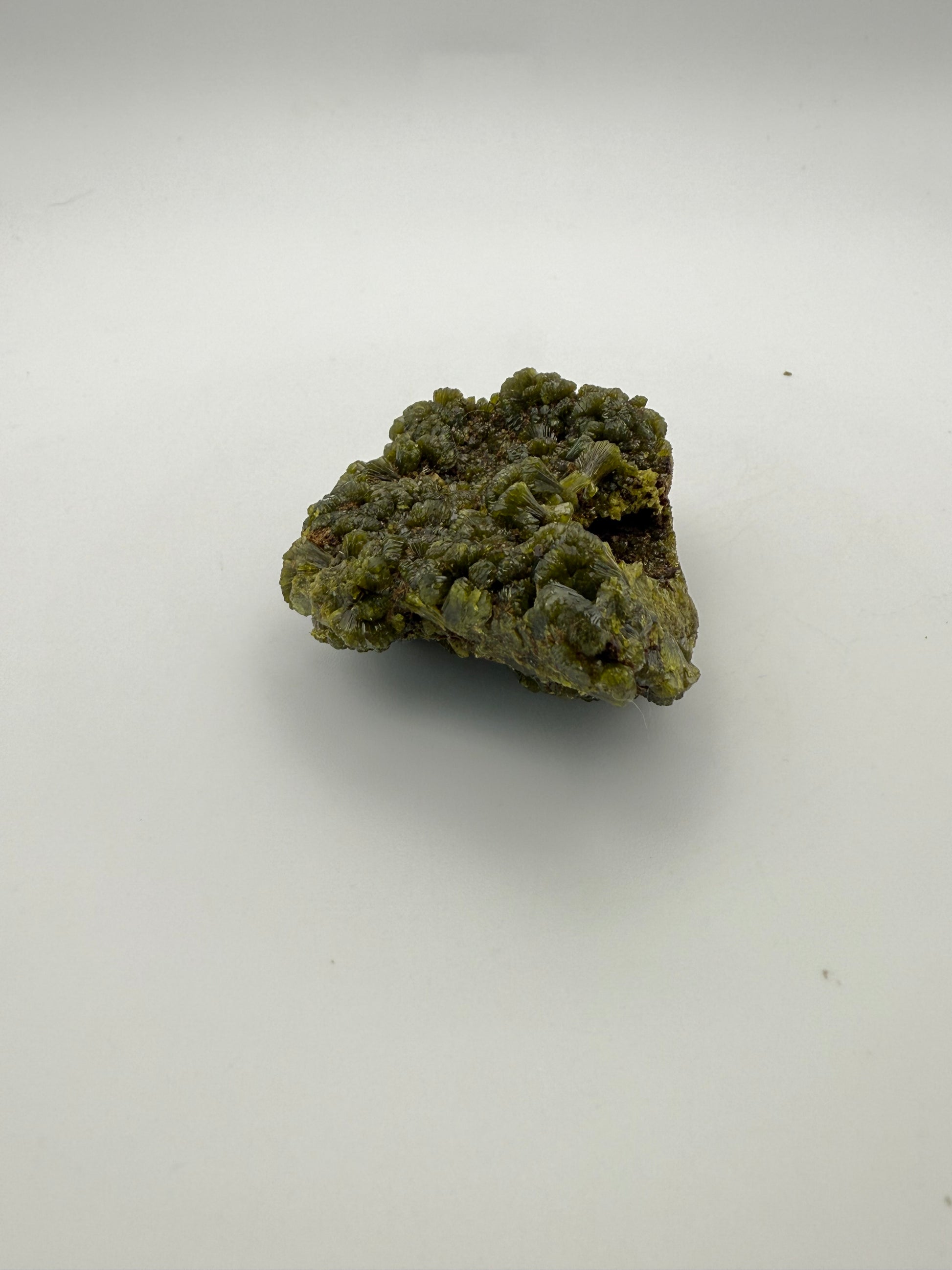 Epidote crystal cluster with good green color.