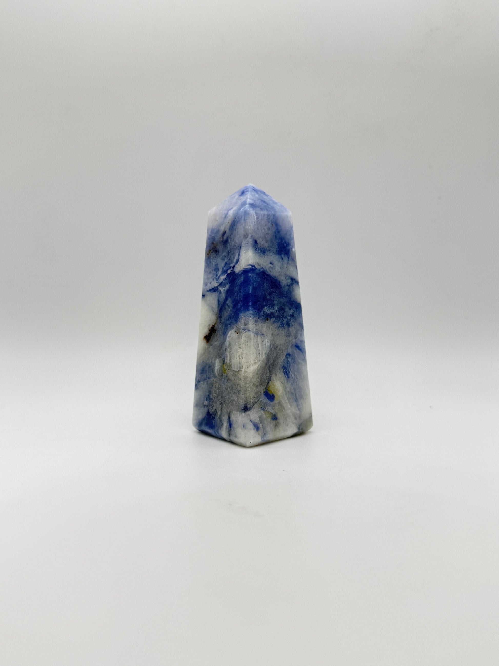 Afghanite four sided tower. Height of 3 1/2 inches, width of 1 1/4 inches.