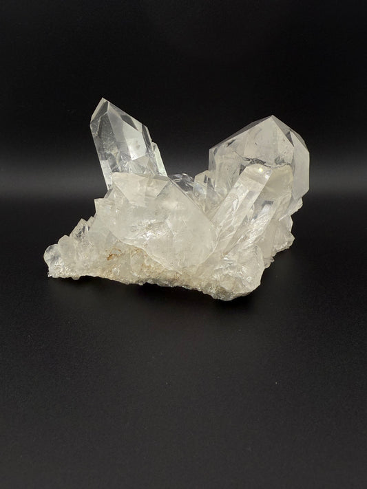 Large cluster of clear quartz crystals.