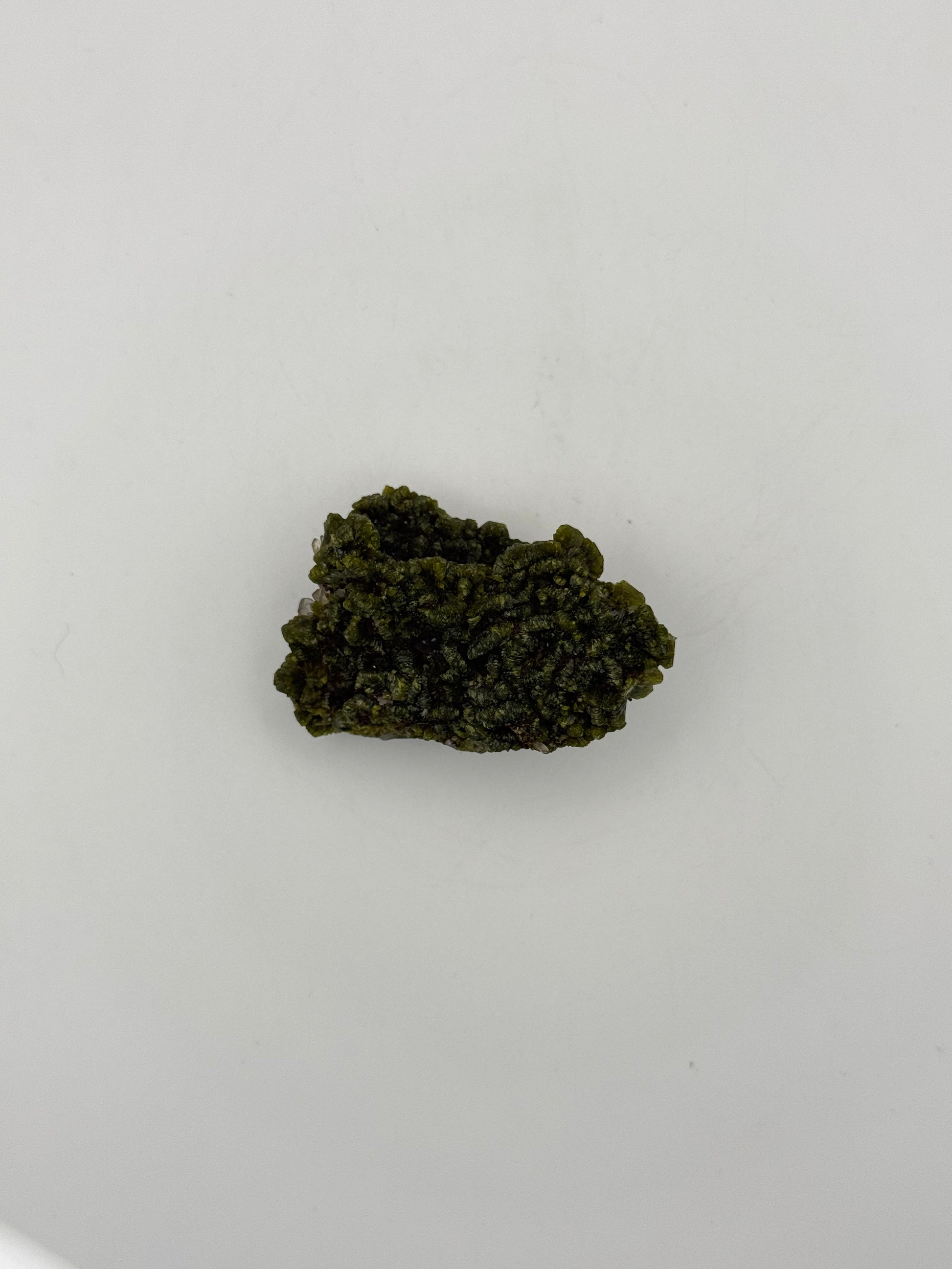 Epidote crystal cluster with good green color.